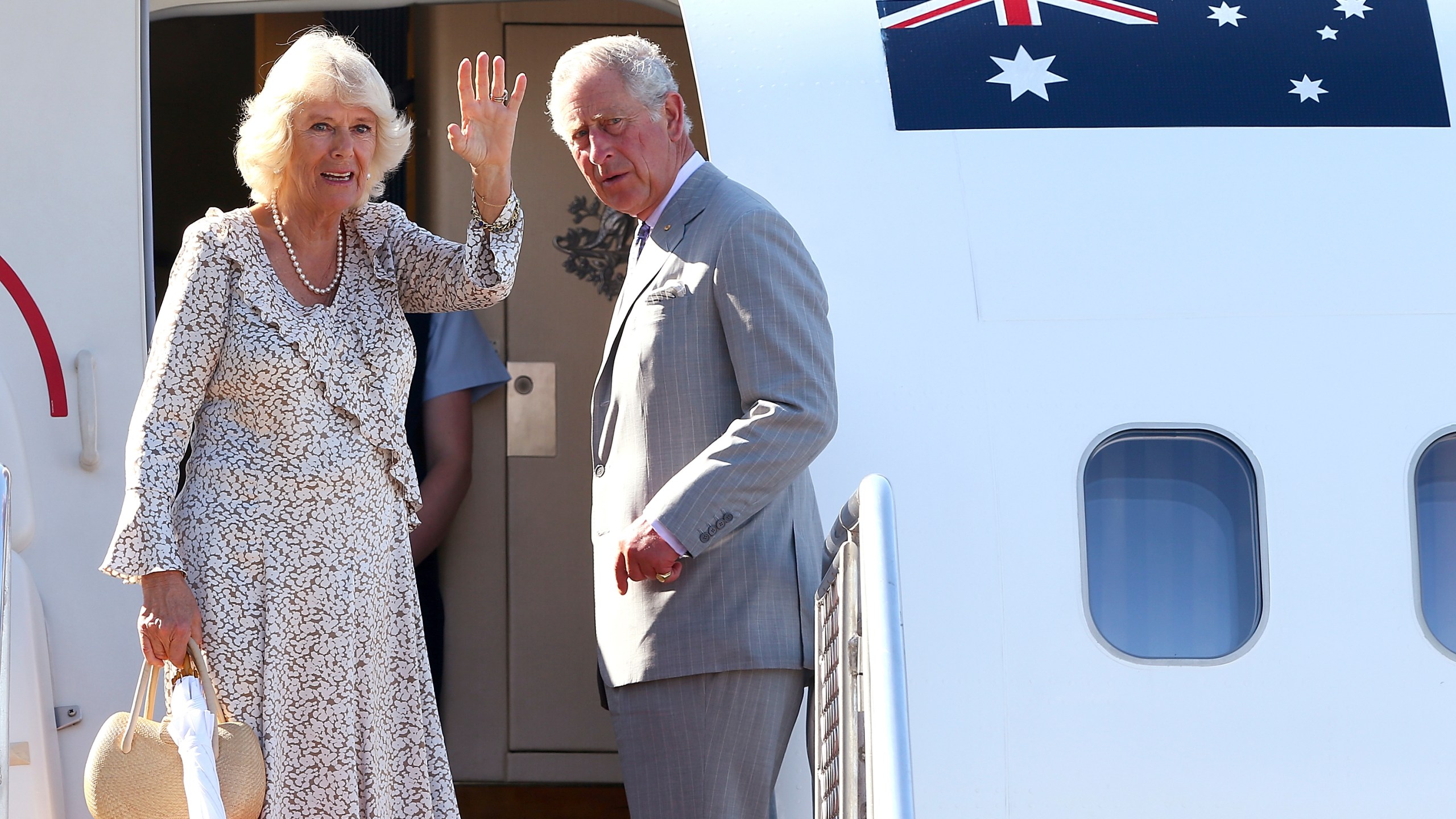 FILE - Britain's Prince Charles, right, and his wife Camilla, Duchess of Cornwall, wave as they prepare to depart Perth, Australia, on Nov. 15, 2015. (Paul Kane/Pool Photo via AP, File )