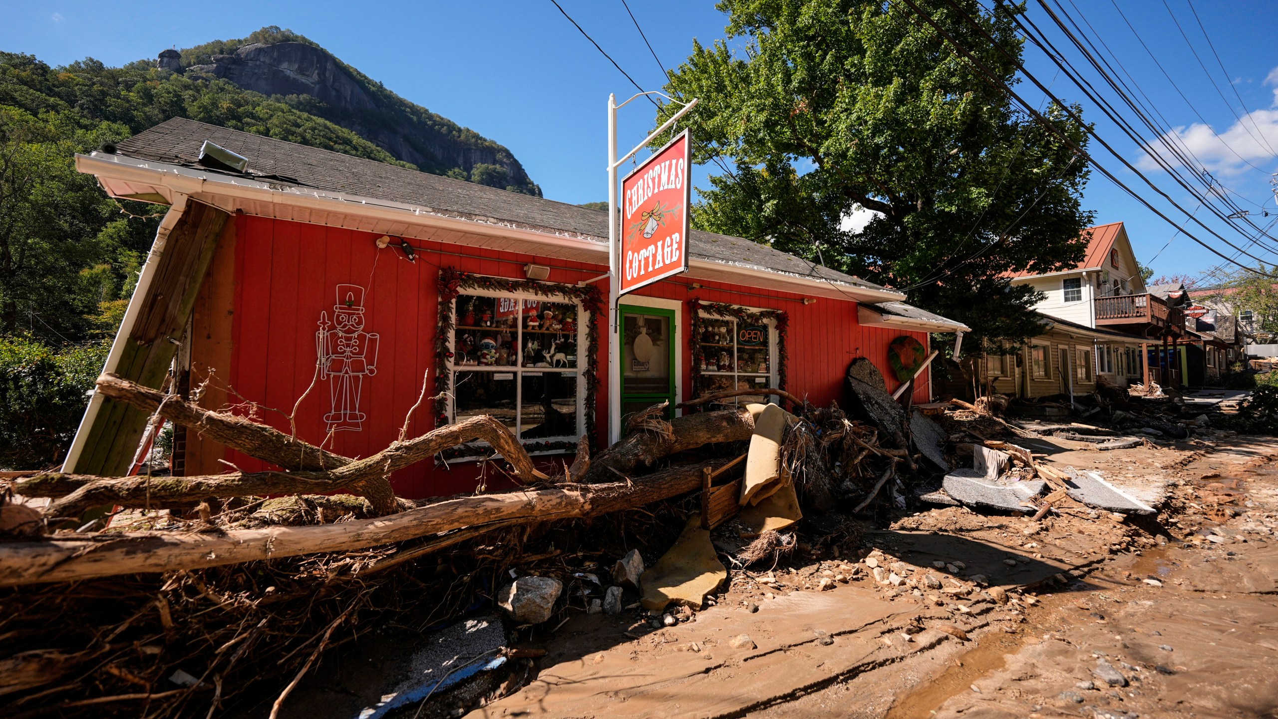 Businesses are seen in a debris field in the aftermath of Hurricane Helene, Wednesday, Oct. 2, 2024, in Chimney Rock Village, N.C. (AP Photo/Mike Stewart)