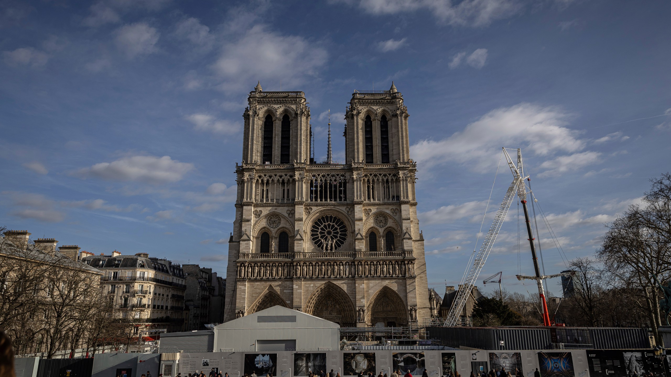 FILE - Scaffolding is being removed around the spire of Notre Dame de Paris cathedral, showing the rooster and the cross, in Paris, Feb. 17, 2024. (AP Photo/Aurelien Morissard, File)