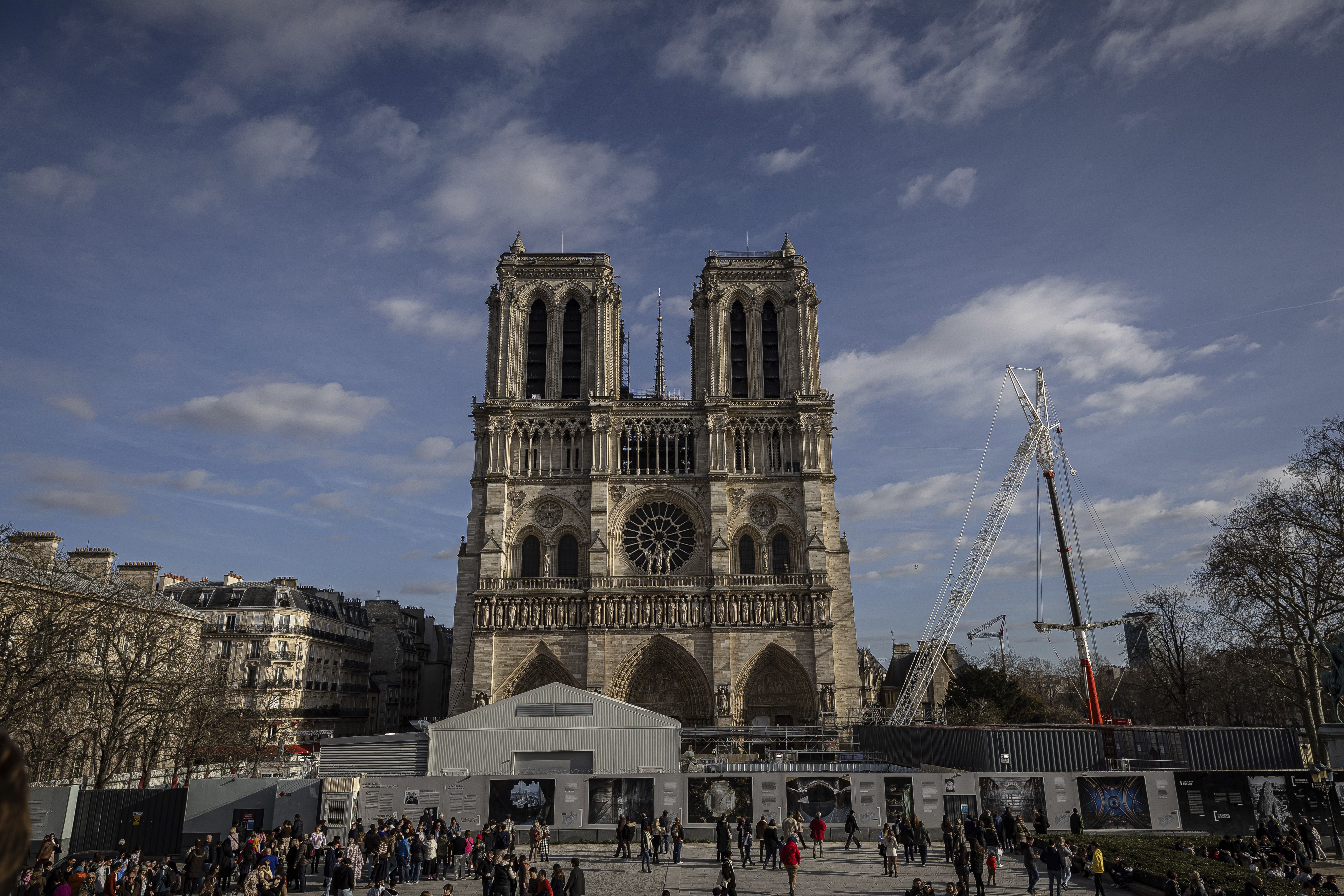 FILE - Scaffolding is being removed around the spire of Notre Dame de Paris cathedral, showing the rooster and the cross, in Paris, Feb. 17, 2024. (AP Photo/Aurelien Morissard, File)