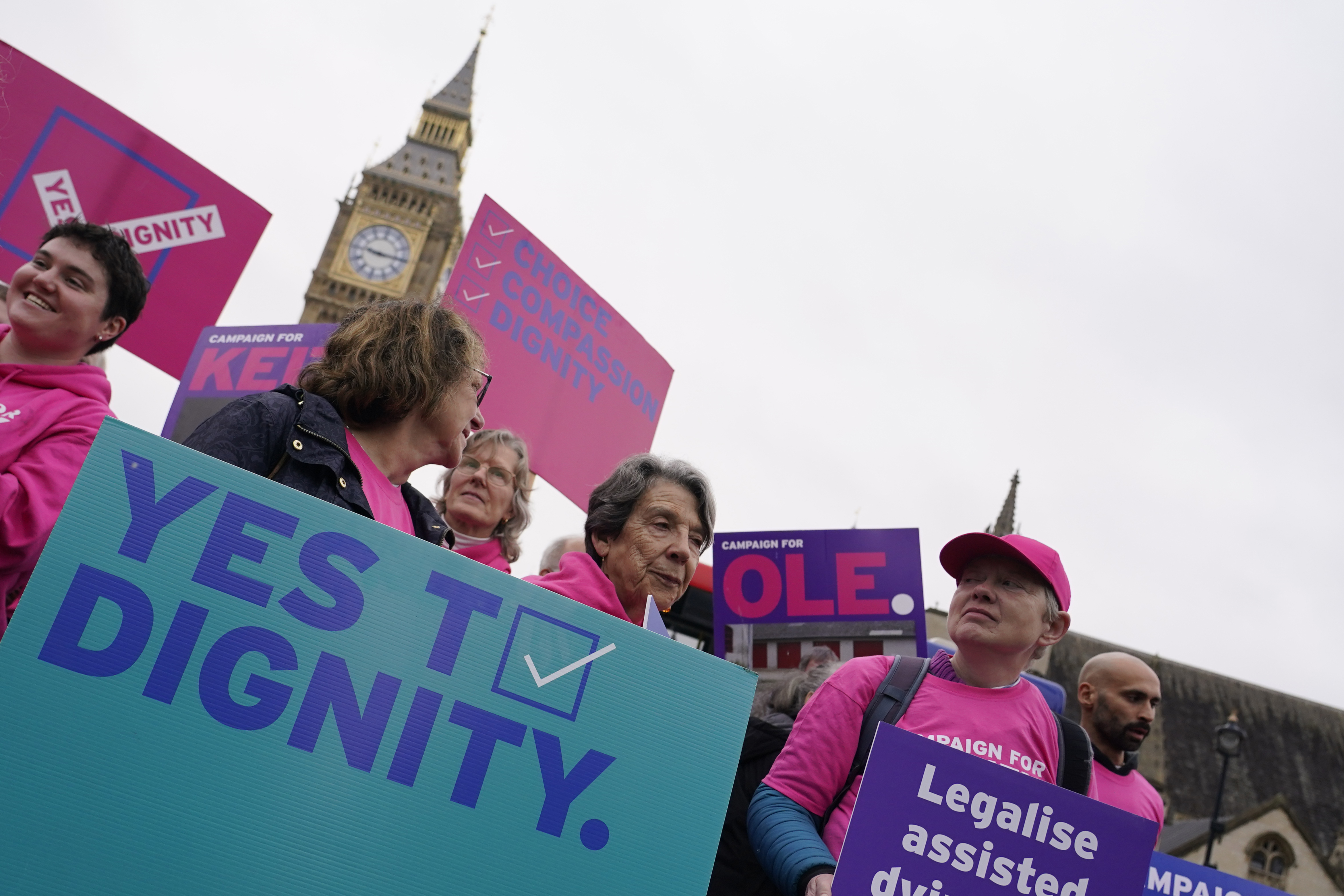 A small demonstration by people advocating assisted dying hold a protest outside the Hoses of Parliament as a bill to legalise assisted dying is to be put before lawmakers in London, England, Wednesday, Oct. 16, 2024. (AP Photo/Alberto Pezzali)