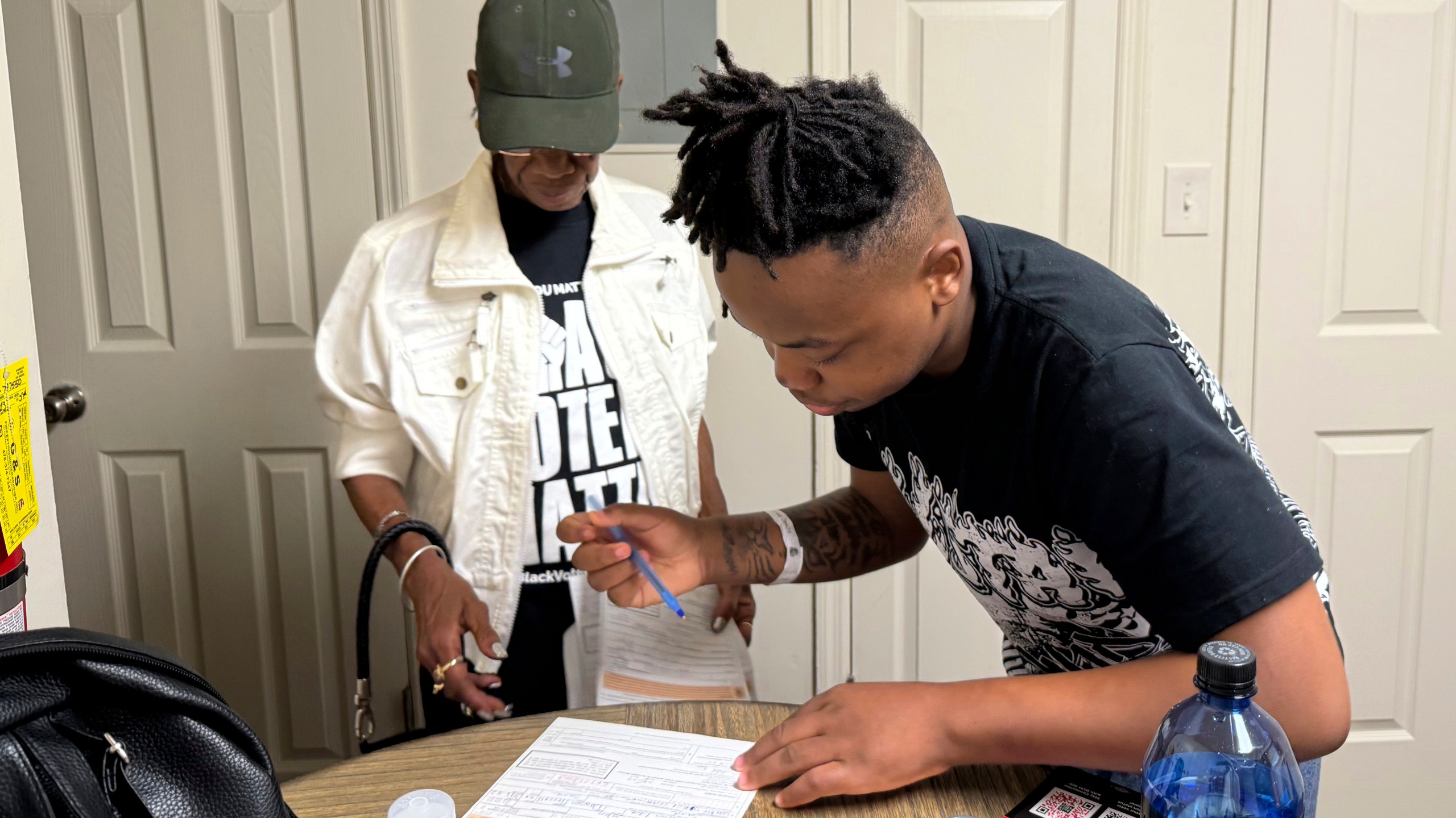 Patricia Powell helps Jaleen Green register to vote in Georgia's Terrell County on Oct. 5, 2024. (AP Photo/Charlotte Kramon)