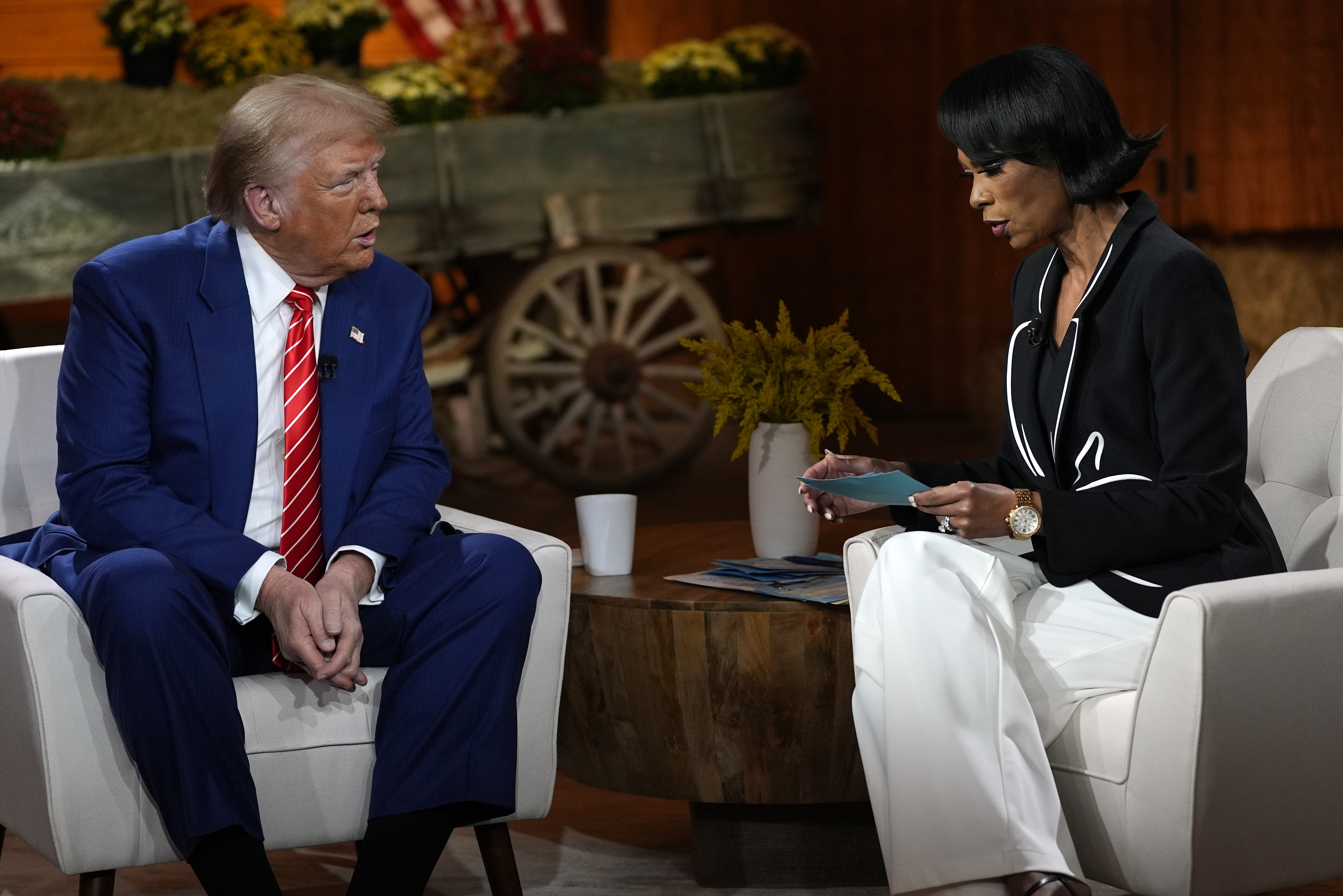 Republican presidential nominee former President Donald Trump speaks during a break in a Fox News town hall with Harris Faulkner at The Reid Barn, Tuesday, Oct. 15, 2024, in Cumming, Ga. (AP Photo/Julia Demaree Nikhinson)