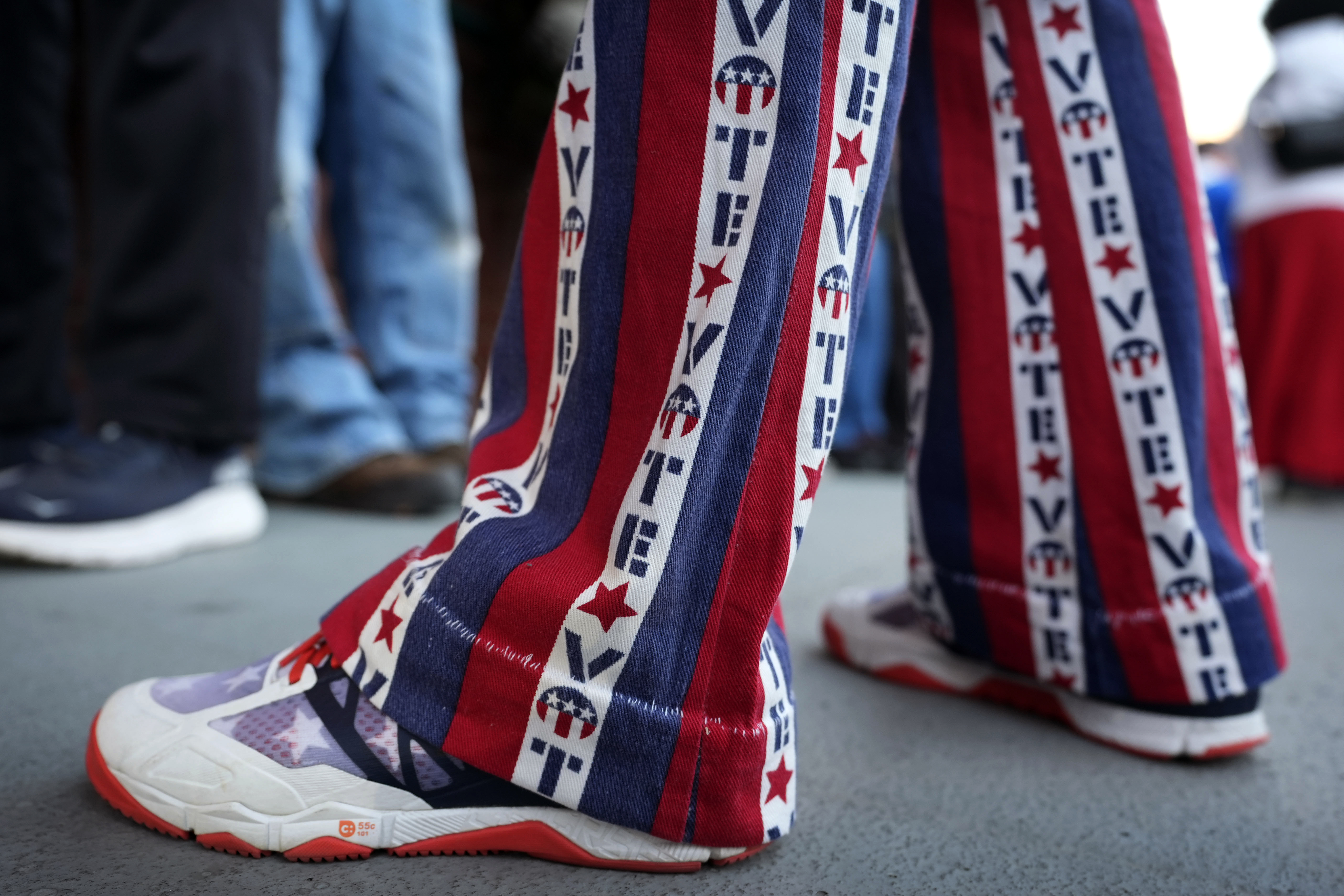 John Olsen, of Ankeny, Iowa, stands in line for early voting at the Polk County Election Office, Wednesday, Oct. 16, 2024, in Des Moines, Iowa. (AP Photo/Charlie Neibergall)