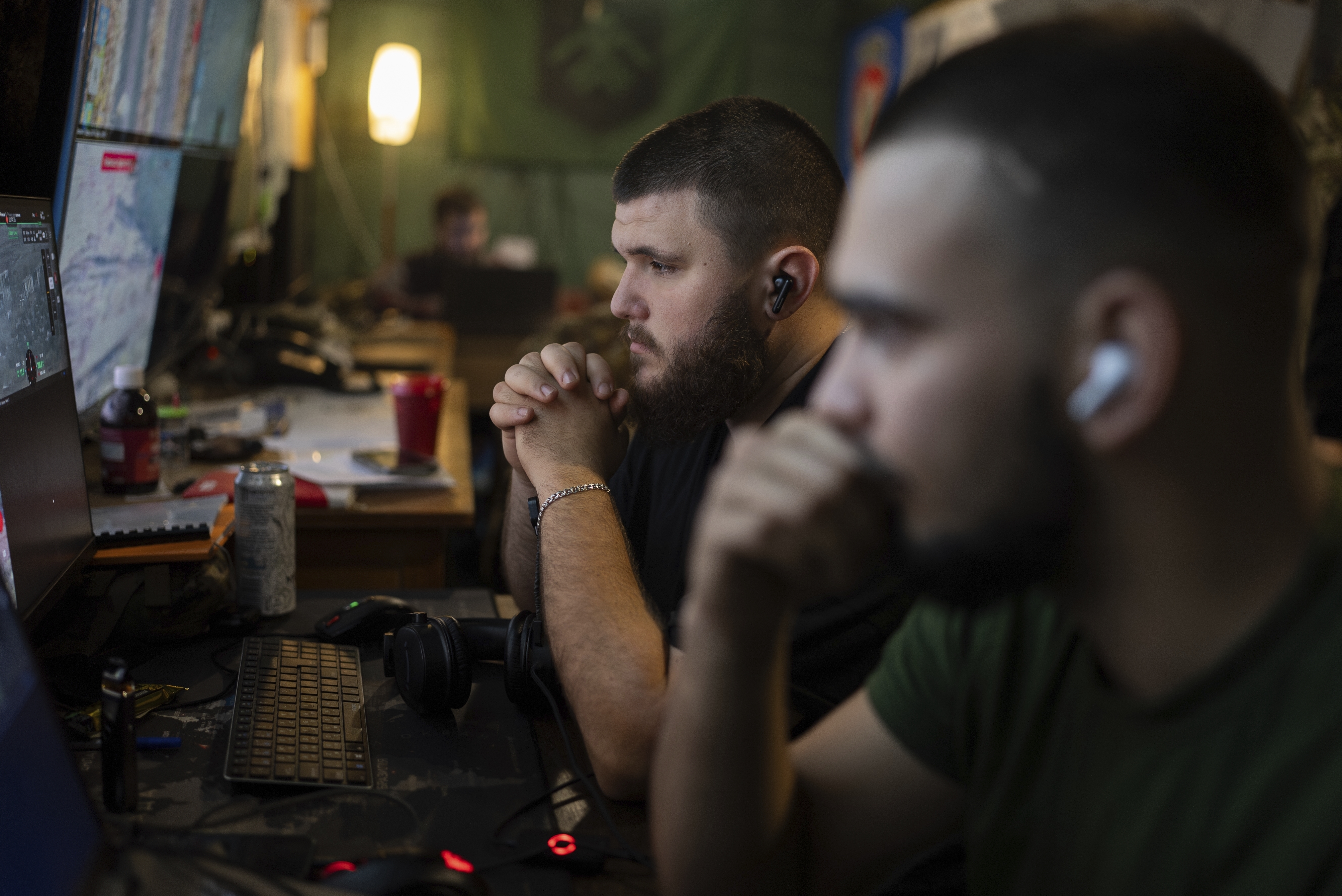 Ukrainian servicemen of Khartia brigade control the drone aerial view in the command centre in Kharkiv region, Ukraine, Wednesday, Oct. 16, 2024. (AP Photo/Alex Babenko)