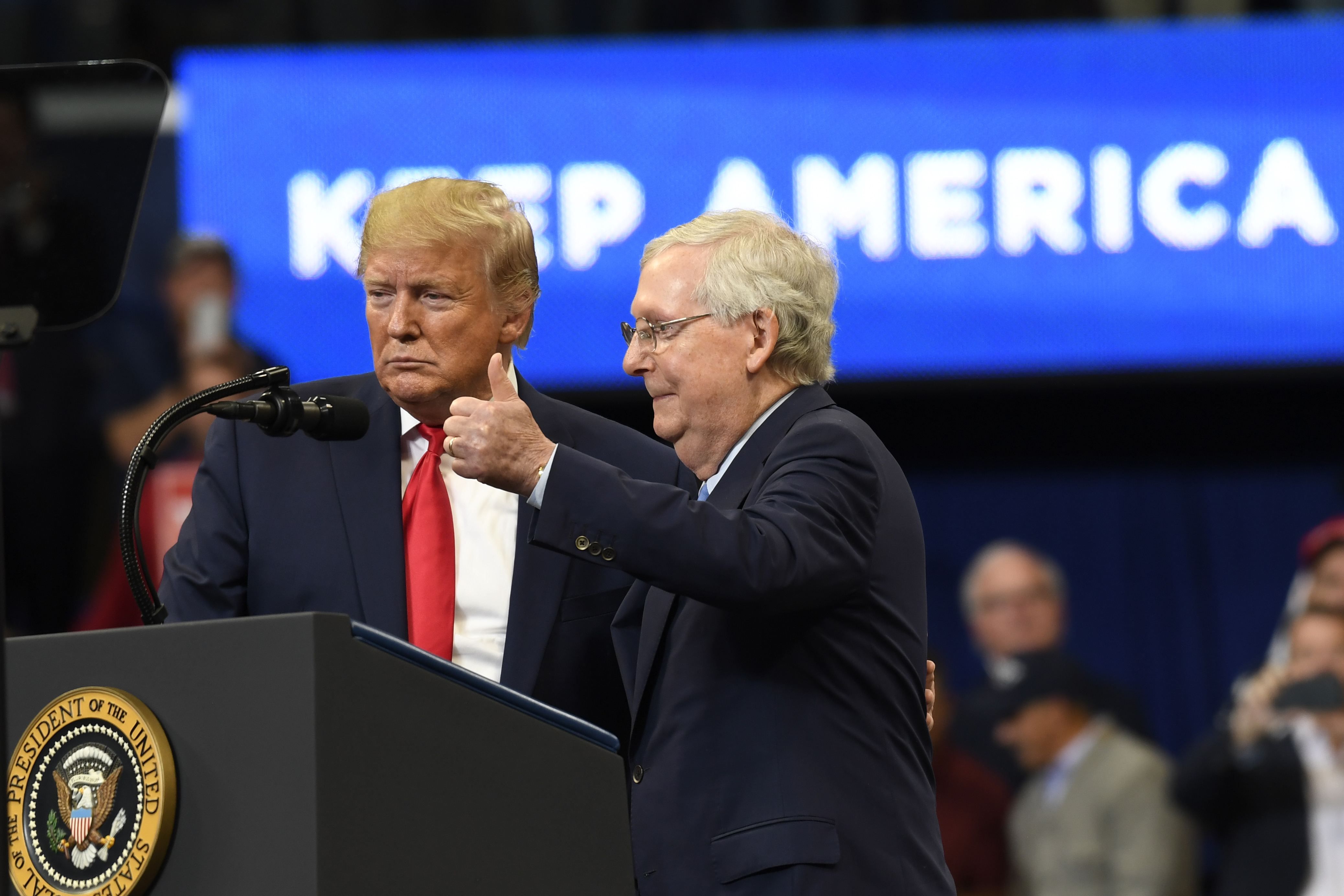 FILE - President Donald Trump brings Senate Majority Leader Mitch McConnell of Ky., on stage during a campaign rally in Lexington, Ky., Nov. 4, 2019. (AP Photo/Susan Walsh, File)