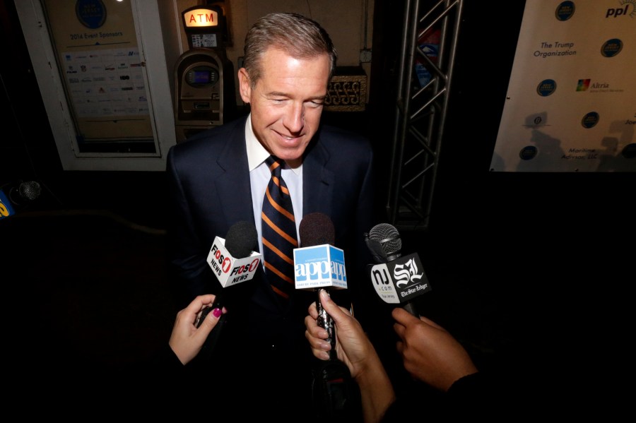 FILE - Television journalist Brian Williams arrives at the Asbury Park Convention Hall during red carpet arrivals prior to the New Jersey Hall of Fame inductions, in Asbury Park, N.J., Nov. 13, 2014. (AP Photo/Julio Cortez, File)