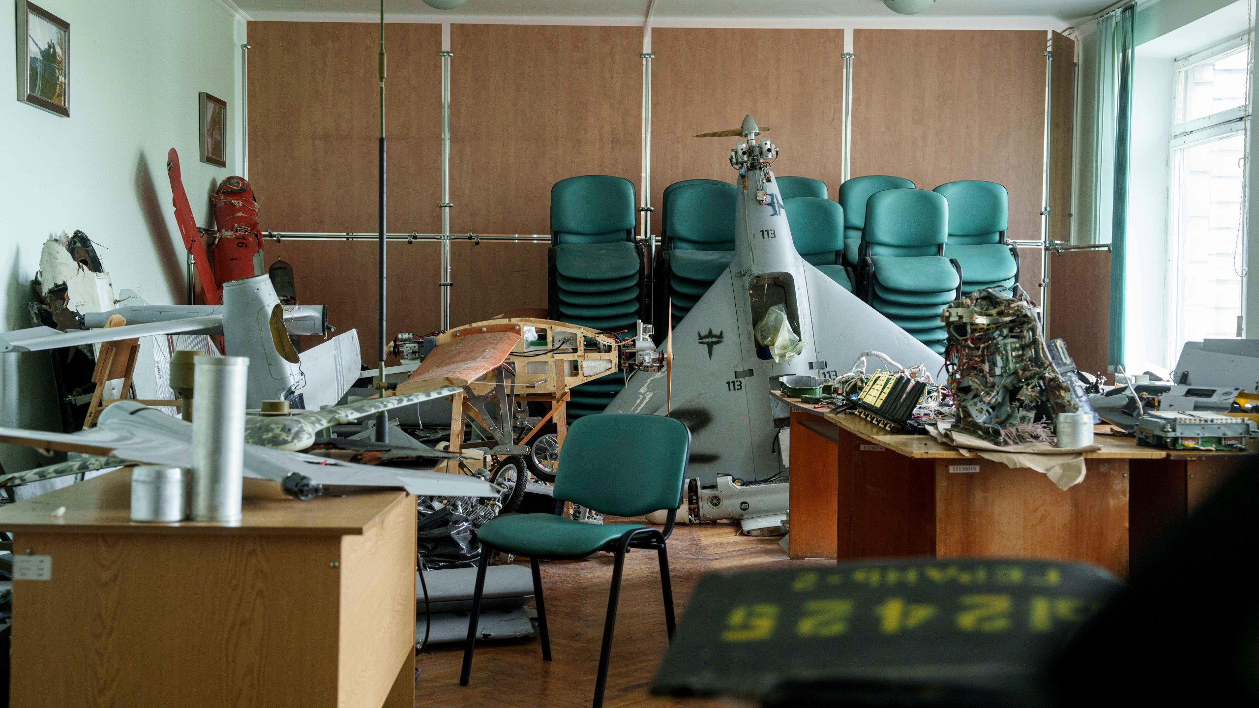 Parts of downed Shahed drones launched by Russia are piled in a storage room of a research laboratory in Kyiv, Ukraine, on Aug. 28, 2024. (AP Photo/Evgeniy Maloletka)