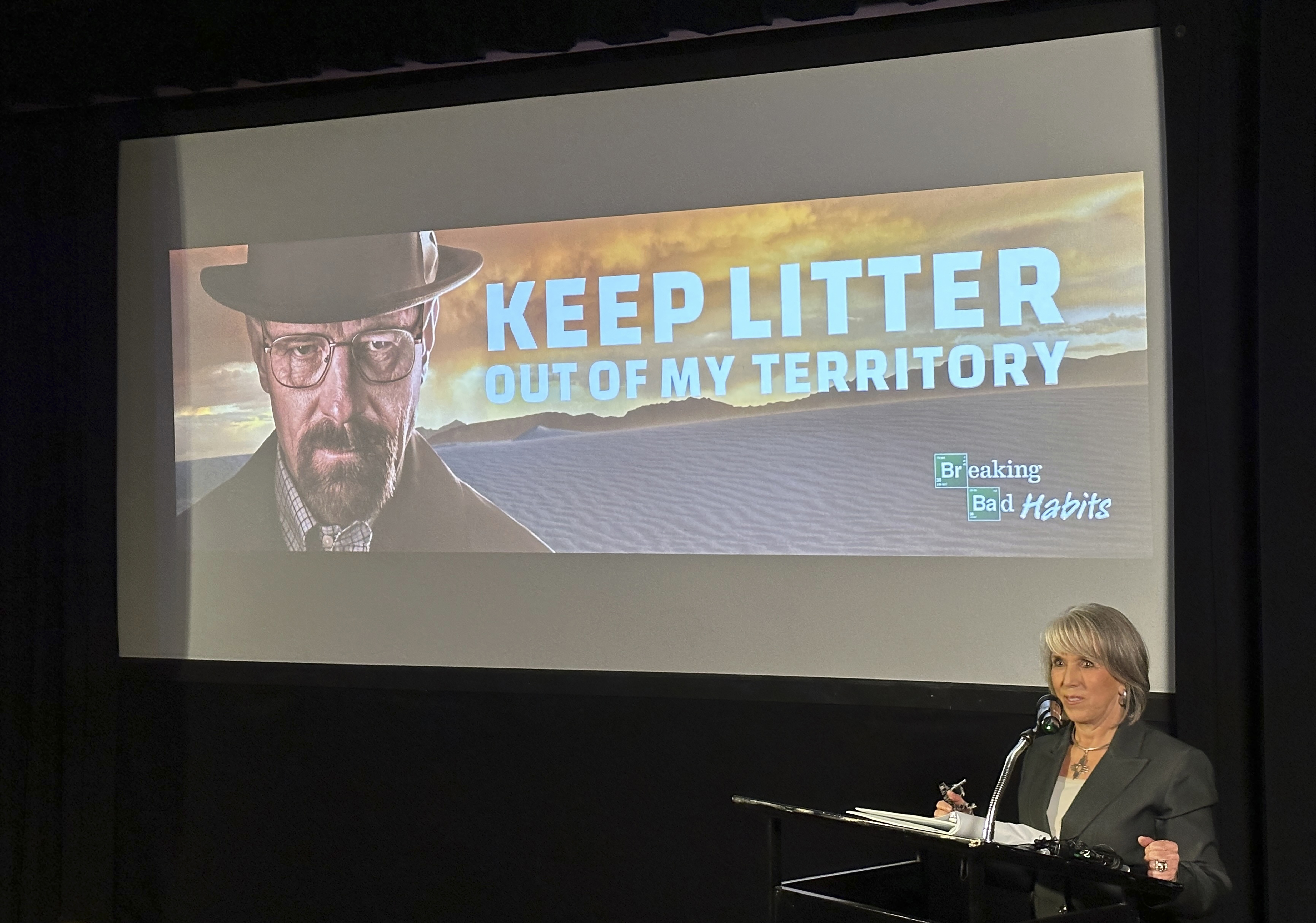 New Mexico Gov. Michelle Lujan Grisham introduces a public service ad campaign against littering that features "Breaking Bad" actor Bryan Cranston in a reprise of the series' character Walter White, on Thursday, Oct. 17, 2024, in Santa Fe, N.M.. (AP Photo/Morgan Lee)