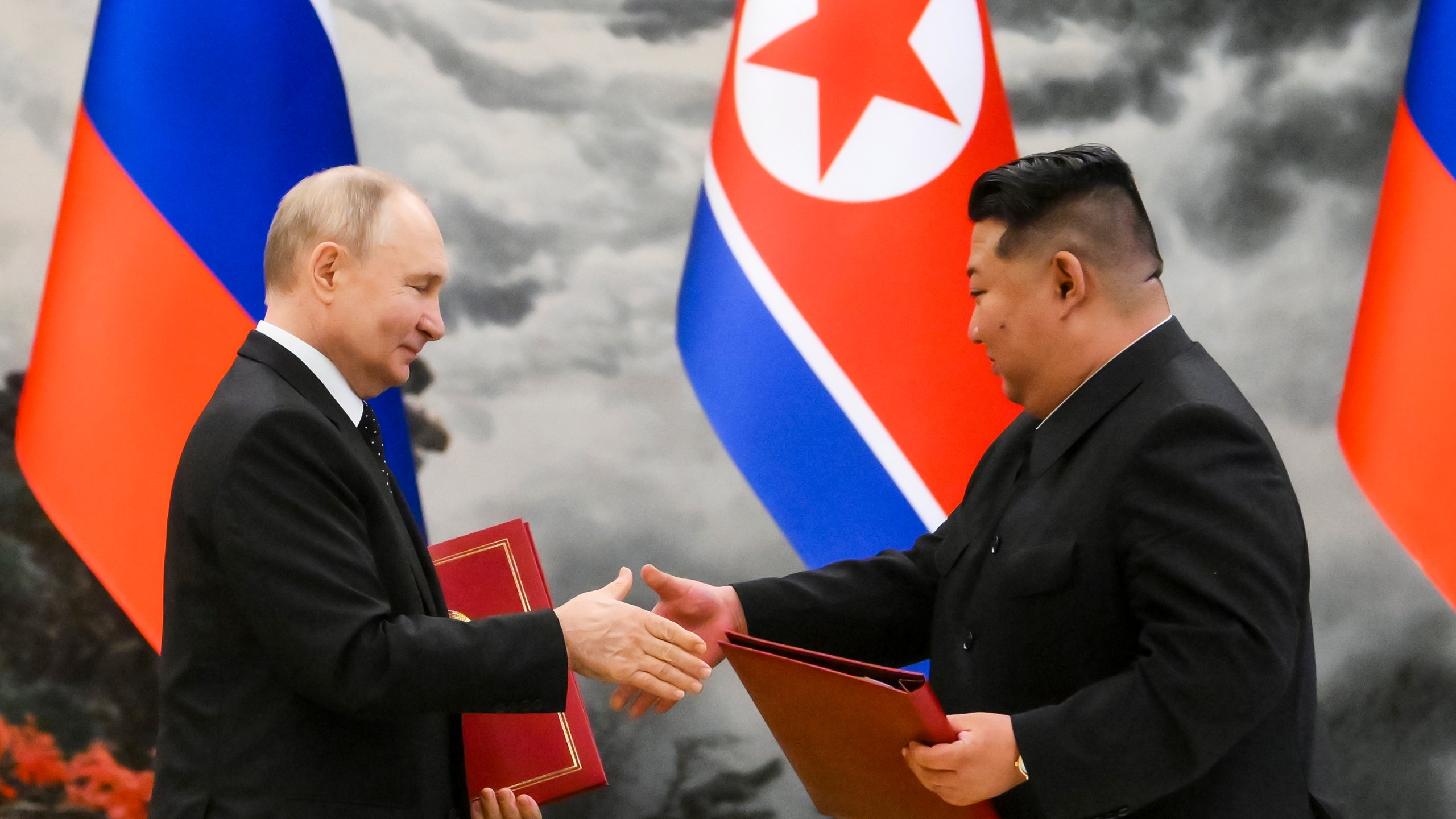 FILE - Russian President Vladimir Putin, left, and North Korea's leader Kim Jong Un exchange documents during a signing ceremony of the new partnership in Pyongyang, North Korea, on June 19, 2024. (Kristina Kormilitsyna, Sputnik, Kremlin Pool Photo via AP, File)