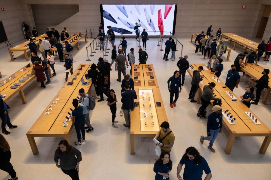 FILE - People gather at an Apple store for the release of the iPhone 14 on Sept. 16, 2022, in New York. (AP Photo/Yuki Iwamura, File)