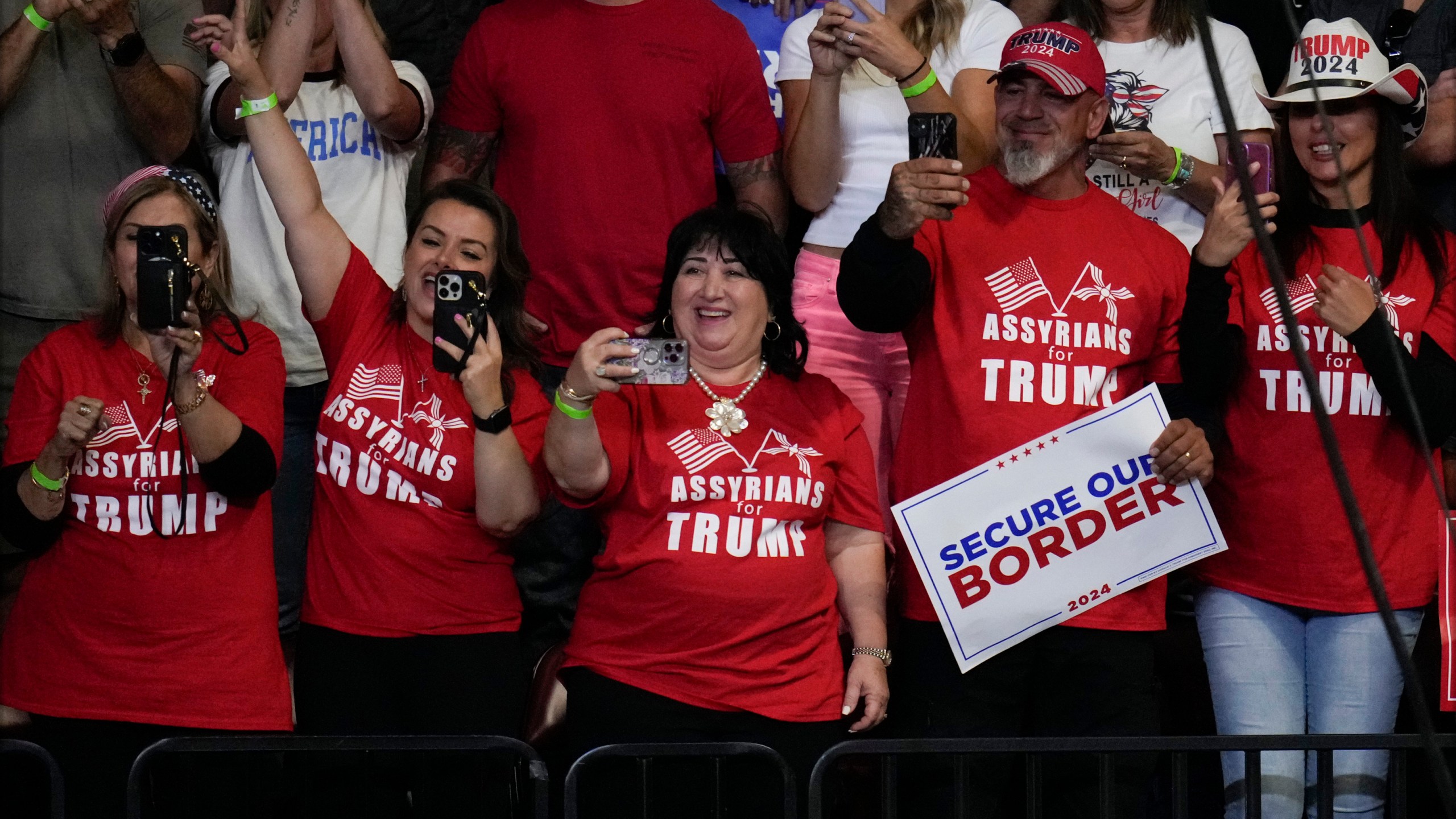 Supporters react before Republican presidential nominee former President Donald Trump speaks at a campaign rally at the Findlay Toyota Arena Sunday, Oct. 13, 2024, in Prescott Valley, Ariz. (AP Photo/Ross D. Franklin)