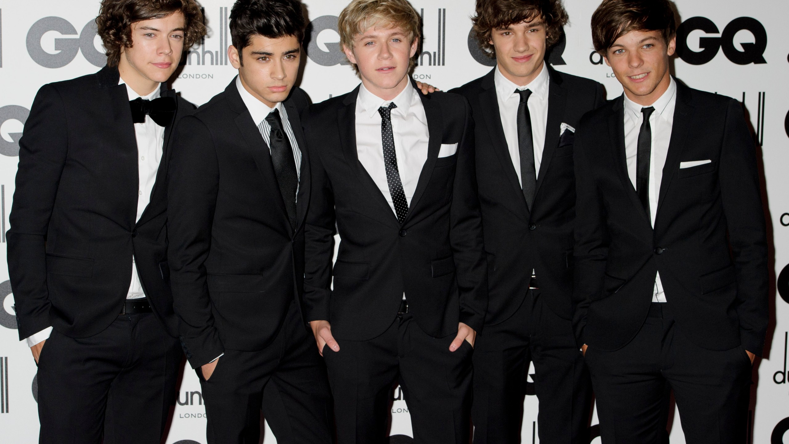 FILE - One Direction's Liam Payne, second from right, poses for a photo with fellow band members Harry Styles, Zayn Malik, Niall Horan and Louis Tomlinson at the GQ Men of the Year Awards in London, Sept. 6, 2011. (AP Photo/Jonathan Short, File)