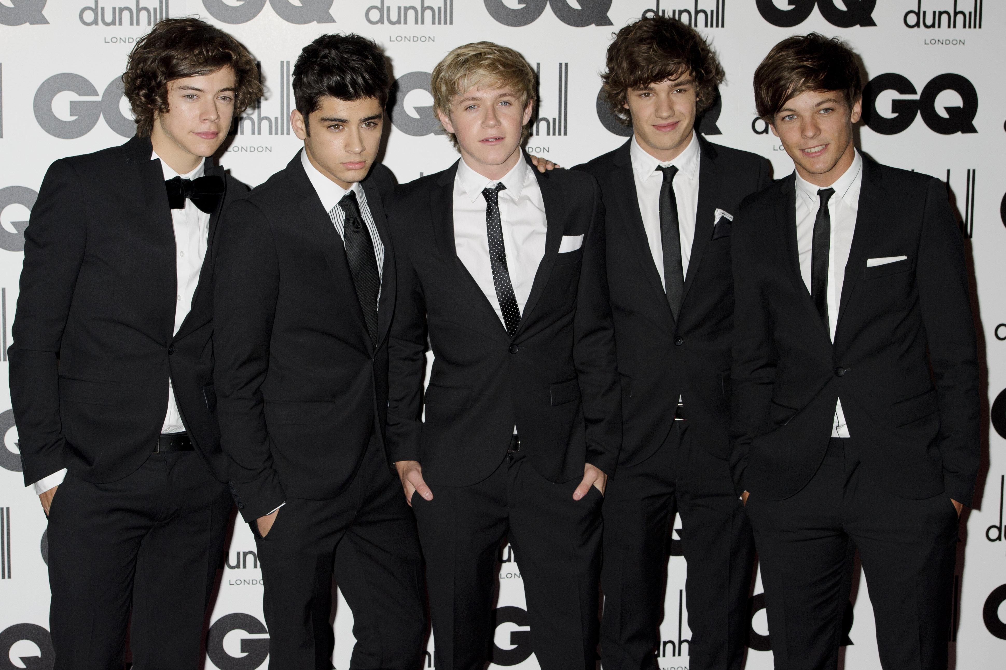 FILE - One Direction's Liam Payne, second from right, poses for a photo with fellow band members Harry Styles, Zayn Malik, Niall Horan and Louis Tomlinson at the GQ Men of the Year Awards in London, Sept. 6, 2011. (AP Photo/Jonathan Short, File)