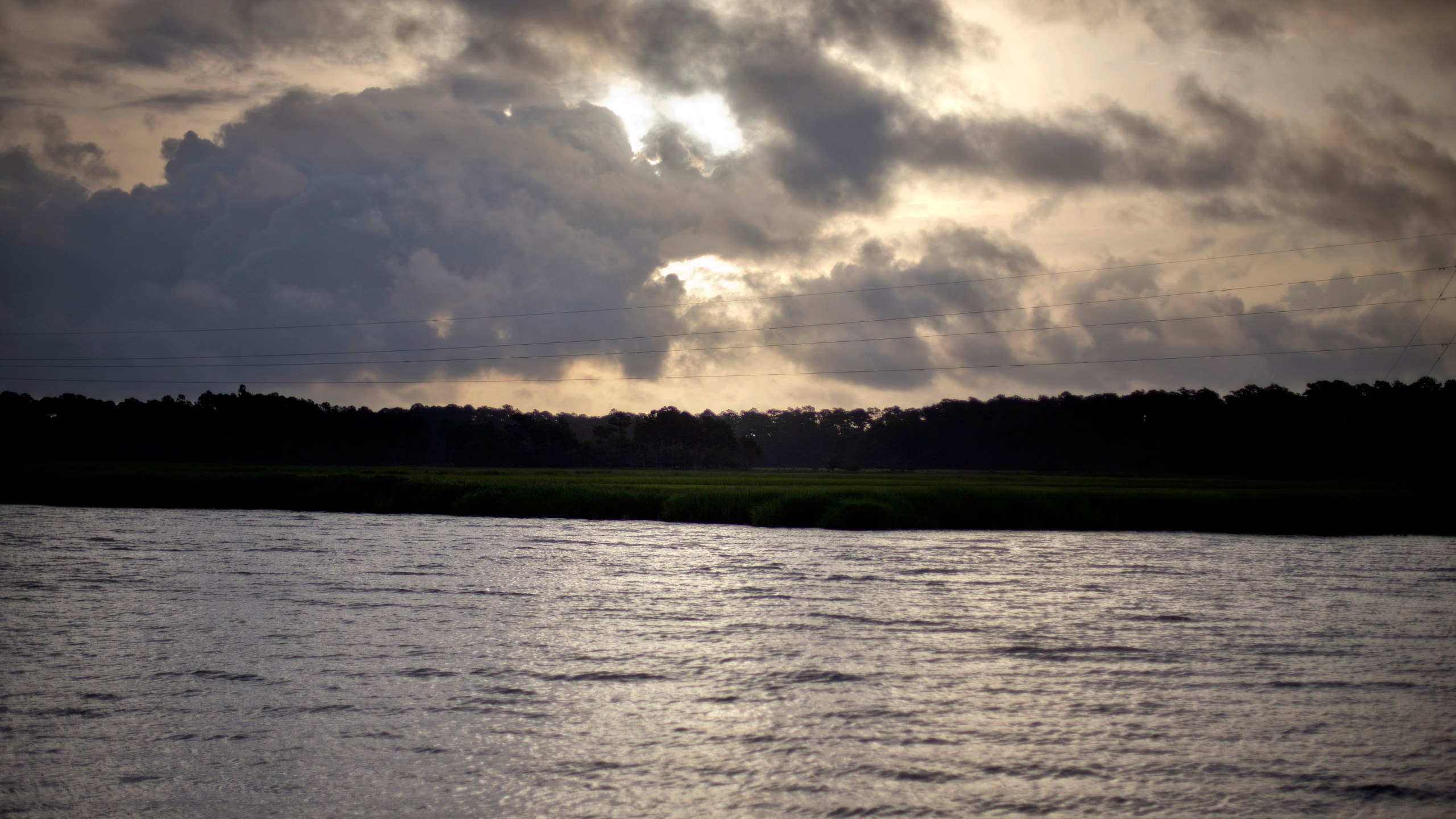 FILE - The sun rises over Sapelo Island, Ga., a Gullah-Geechee community, on June 10, 2013. (AP Photo/David Goldman, File)