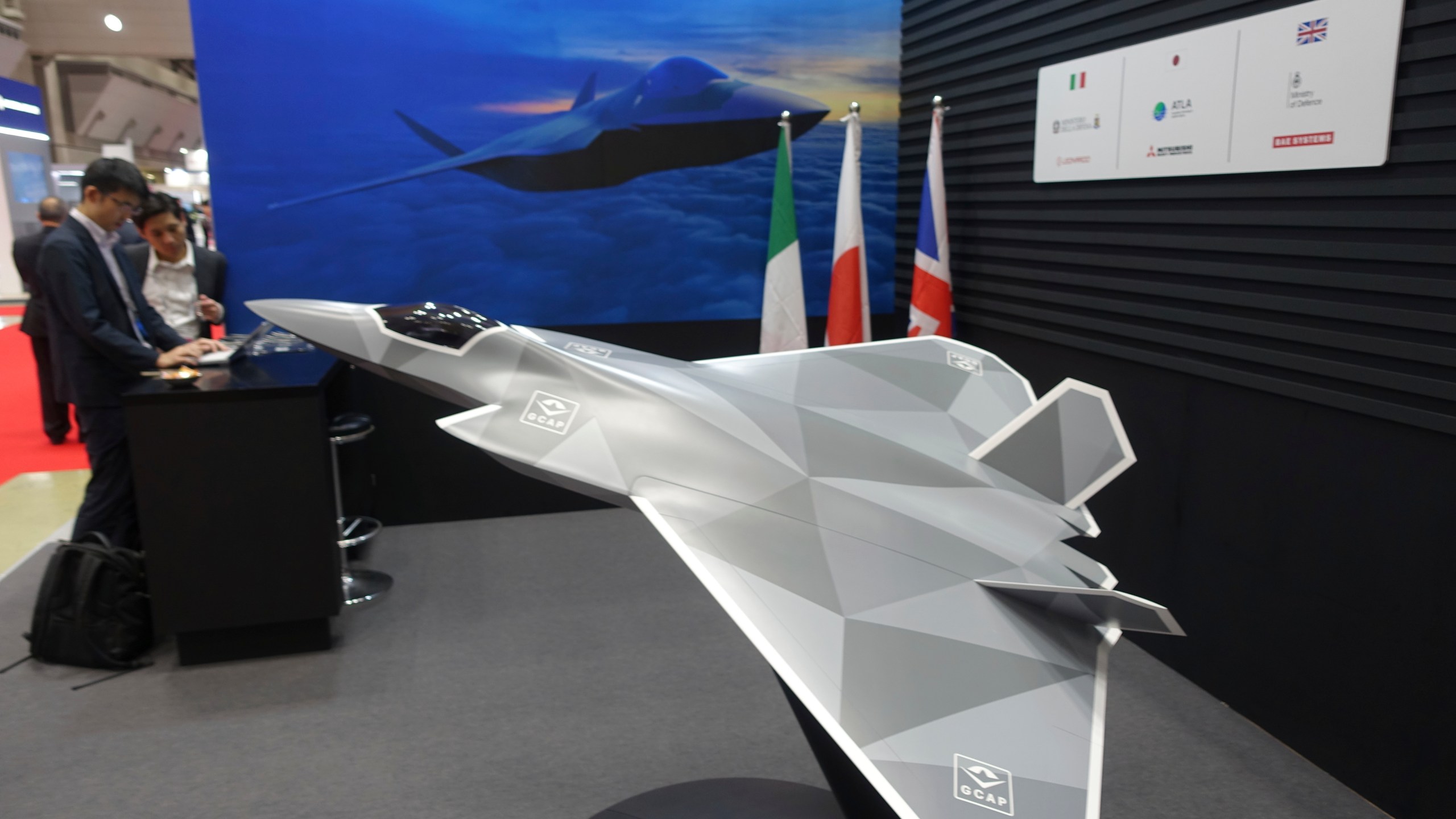 A view of a 1/10 model of a next-generation combat jet Japan to be jointly developed with the UK and Italy for deployment in 2035, on display at a booth of their joint Global Combat Air Program, or GCAP, at the Japan International Aerospace Exhibition, in Tokyo, Oct. 16, 2024. (AP Photo/Mari Yamaguchi)