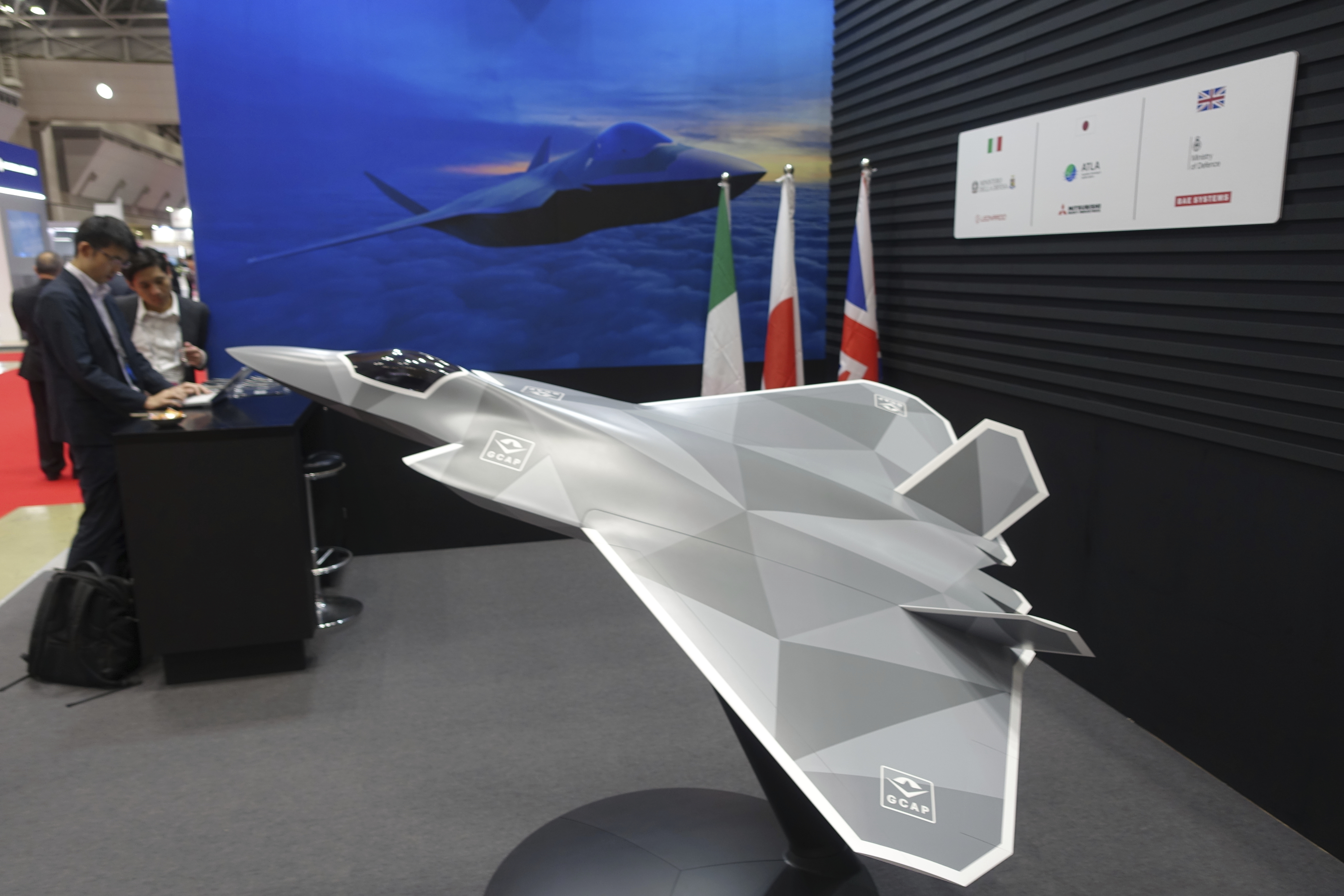 A view of a 1/10 model of a next-generation combat jet Japan to be jointly developed with the UK and Italy for deployment in 2035, on display at a booth of their joint Global Combat Air Program, or GCAP, at the Japan International Aerospace Exhibition, in Tokyo, Oct. 16, 2024. (AP Photo/Mari Yamaguchi)