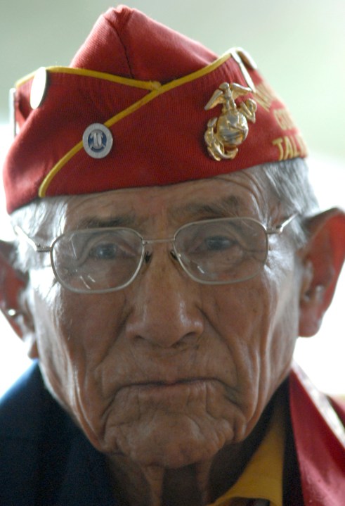 FILE - Navajo Code Talker John Kinsel Sr., of Lukachukai, Ariz., listens as his comrades speak of their WWII experiences Tuesday Aug. 14, 2007, in Window Rock, Ariz. (AP Photo/Donovan Quintero, File)