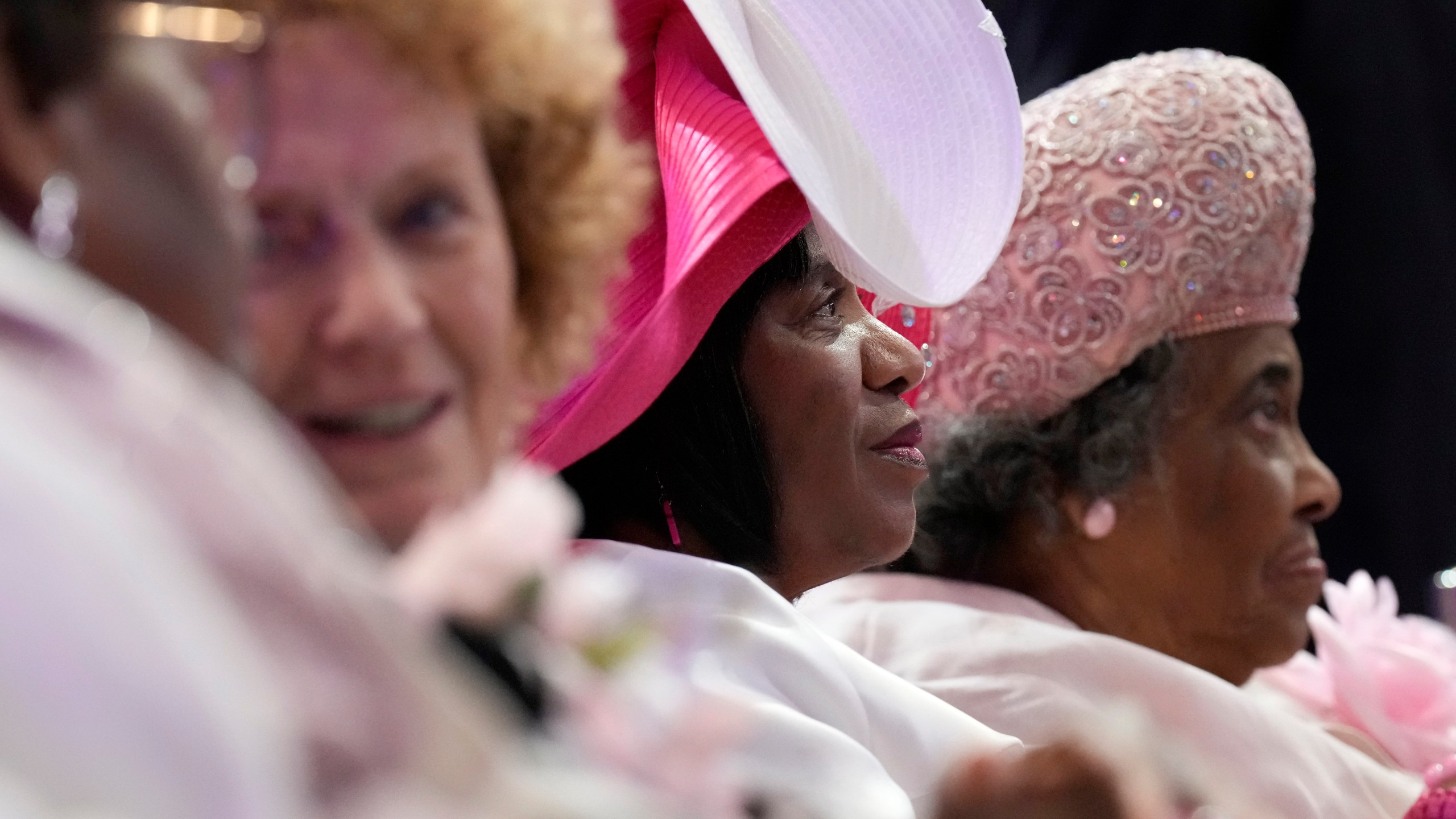 Attendees sit during a church service at New Birth Baptist Church before Democratic presidential nominee Vice President Kamala Harris speaks, in Stonecrest, Ga., Sunday, Oct. 20, 2024. (AP Photo/Jacquelyn Martin)