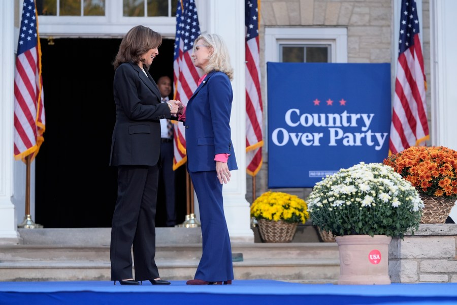 Democratic presidential nominee Vice President Kamala Harris, left, is greeted by former Congresswoman Liz Cheney, R-Wyo., during a campaign event at Ripon College in Ripon, Wis., Thursday, Oct. 3, 2024. (AP Photo/Mark Schiefelbein)