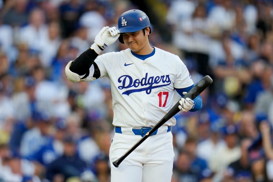 Los Angeles Dodgers' Shohei Ohtani bats against the New York Mets during the first inning in Game 6 of a baseball NL Championship Series, Sunday, Oct. 20, 2024, in Los Angeles. (AP Photo/Julio Cortez)