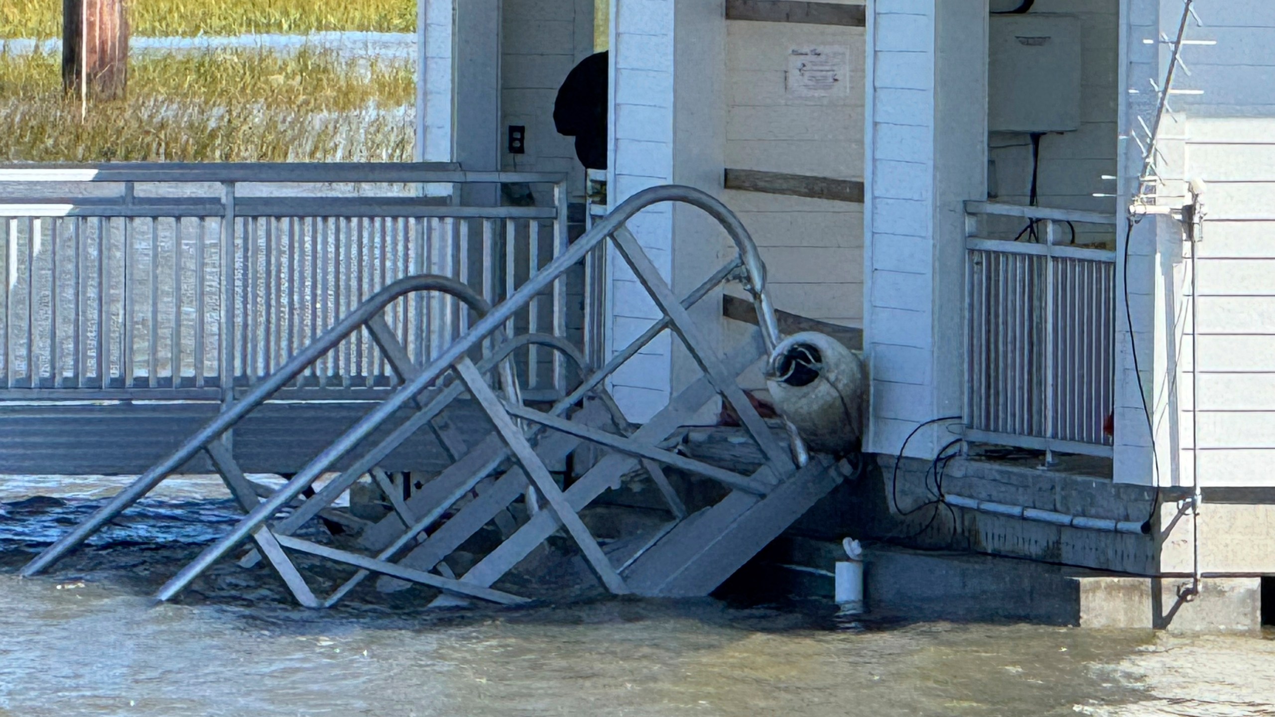 A portion of the gangway which collapsed Saturday afternoon remains visible on Sapelo Island in McIntosh county, Ga., Sunday, Oct. 20, 2024. (AP Photo/Lewis Levine)