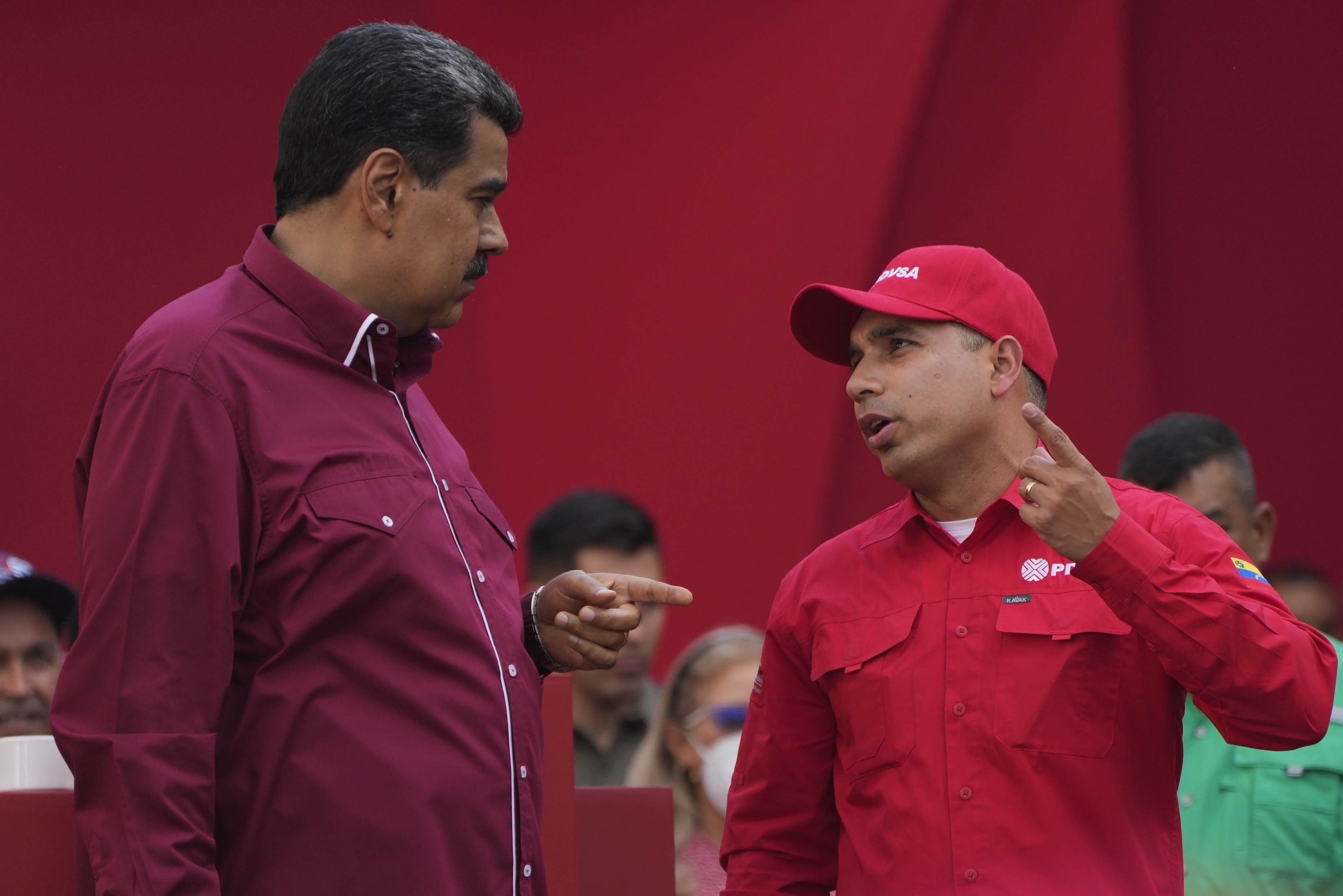 FILE - Venezuelan President Nicolás Maduro, left, speaks with Pedro Tellechea, the oil minister and president of the Venezuelan state oil company PDVSA, during a May Day event in Caracas, Venezuela, May 1, 2023. (AP Photo/Ariana Cubillos, File)