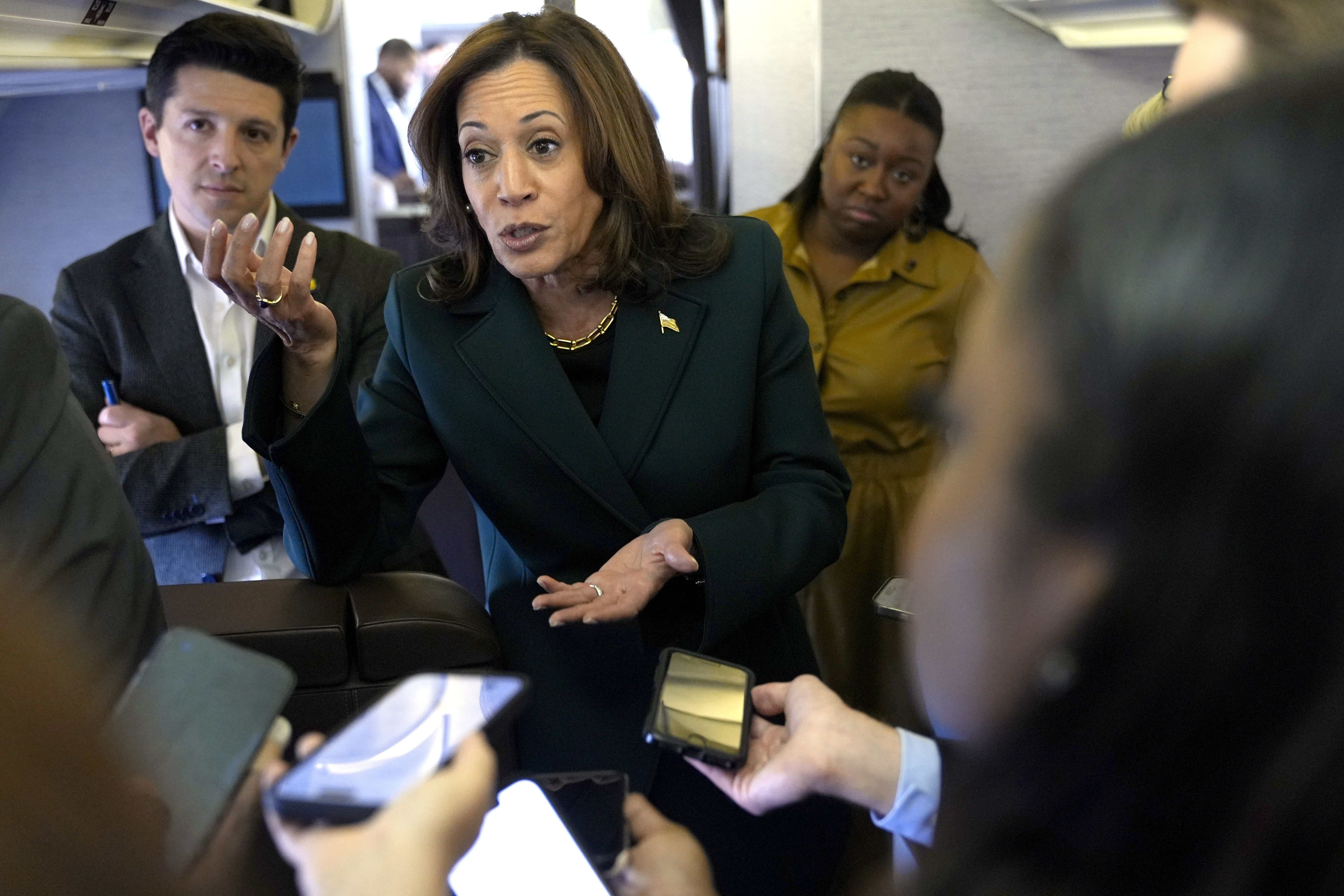 Democratic presidential nominee Vice President Kamala Harris speaks with members of the press on board Air Force Two at Philadelphia International Airport, Monday, Oct. 21, 2024, in Philadelphia, before departing to Michigan. (AP Photo/Jacquelyn Martin, Pool)