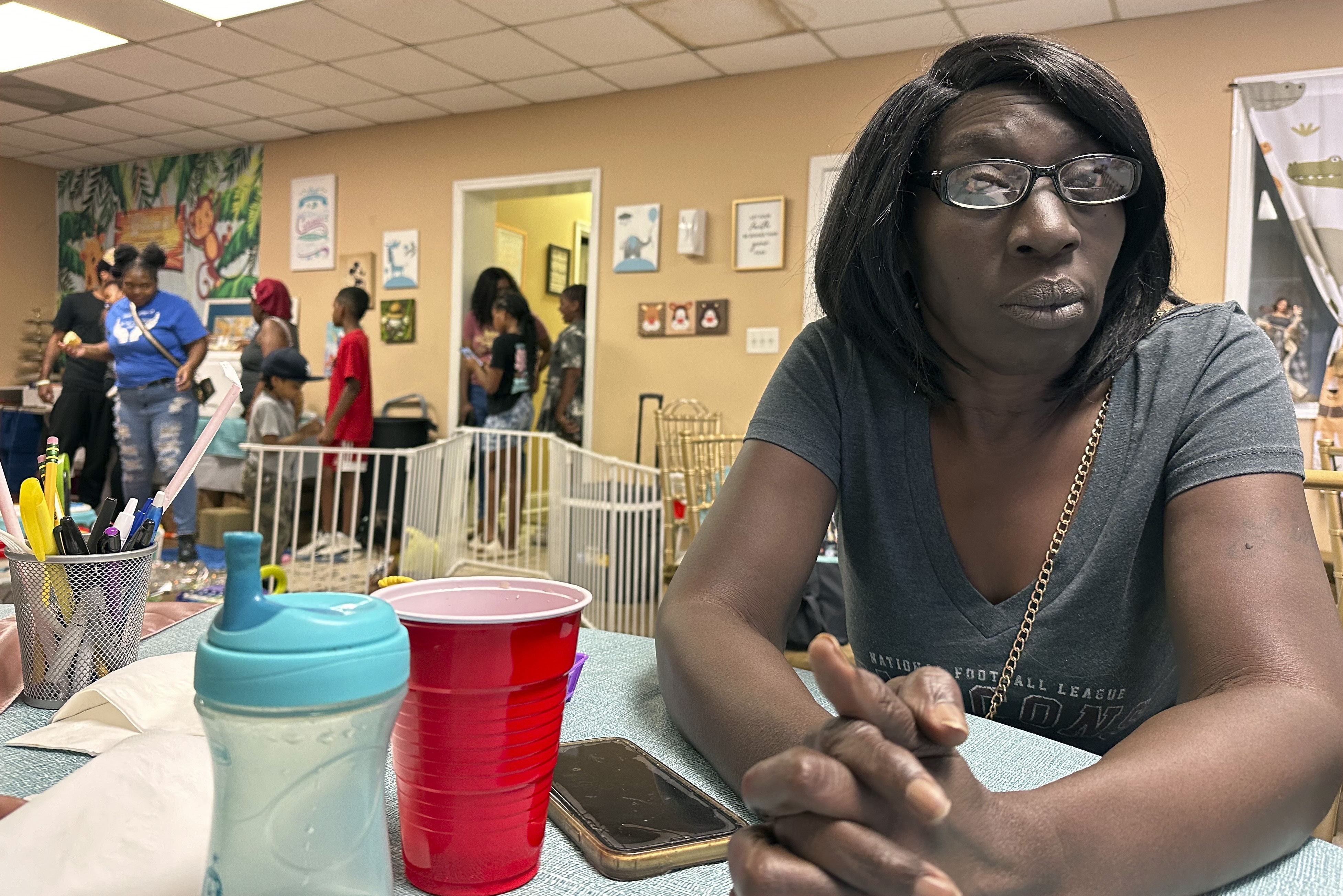 Linda Solomon, a client at Mother's Nest in Macon, Ga., poses for a photo on June 22, 2024. She does not intend to vote because she feels the lives of the poor don't improve regardless of what party controls the White House and government. (AP Photo/Gary Fields)