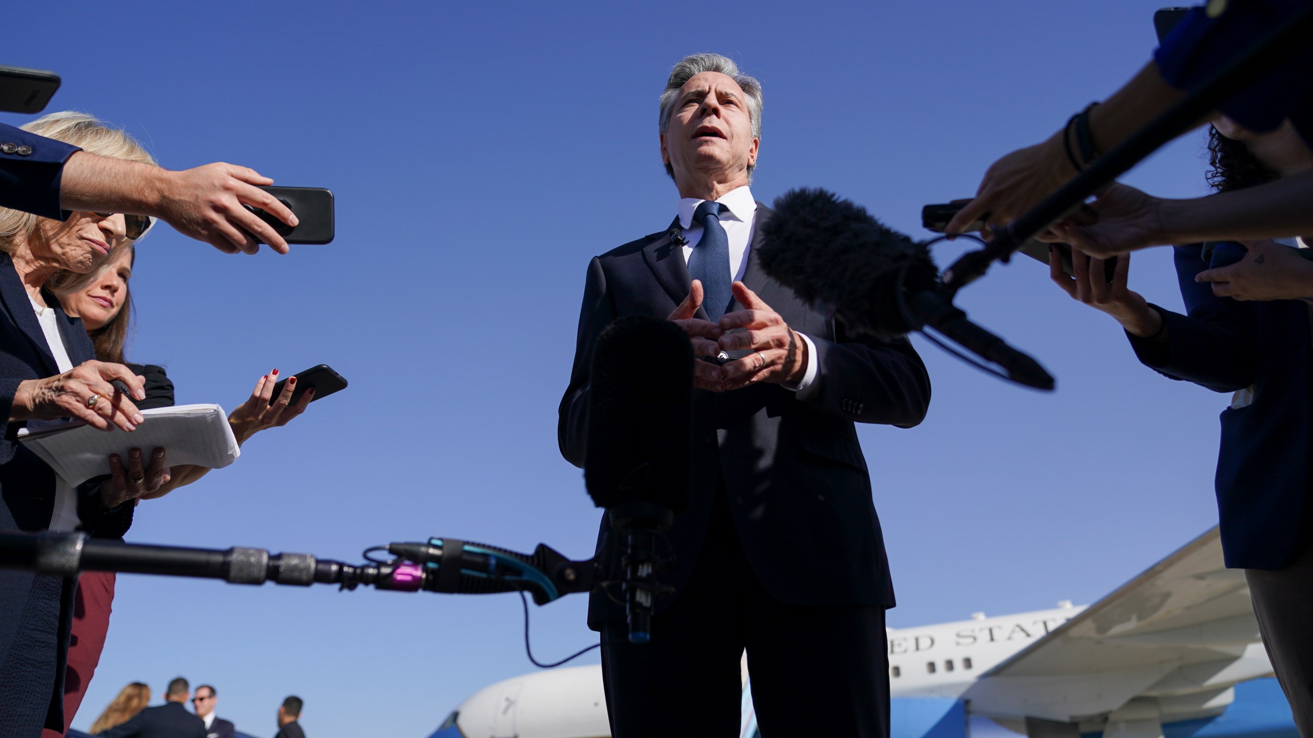 U.S. Secretary of State Antony Blinken speaks with members of the media as he arrives at Ben Gurion International Airport before departing for Riyadh, Saudi Arabia, in Tel Aviv, Israel, Wednesday, Oct. 23, 2024. (Nathan Howard/Pool Photo via AP)