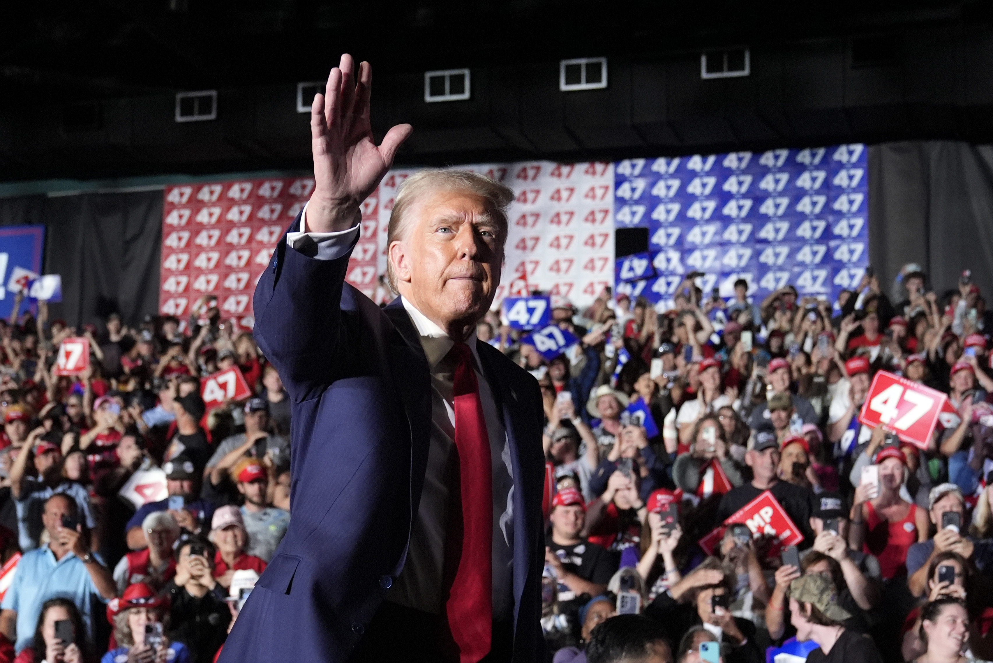 Republican presidential nominee former President Donald Trump waves at a campaign rally at Greensboro Coliseum, Tuesday, Oct. 22, 2024, in Greensboro, N.C. (AP Photo/Alex Brandon)