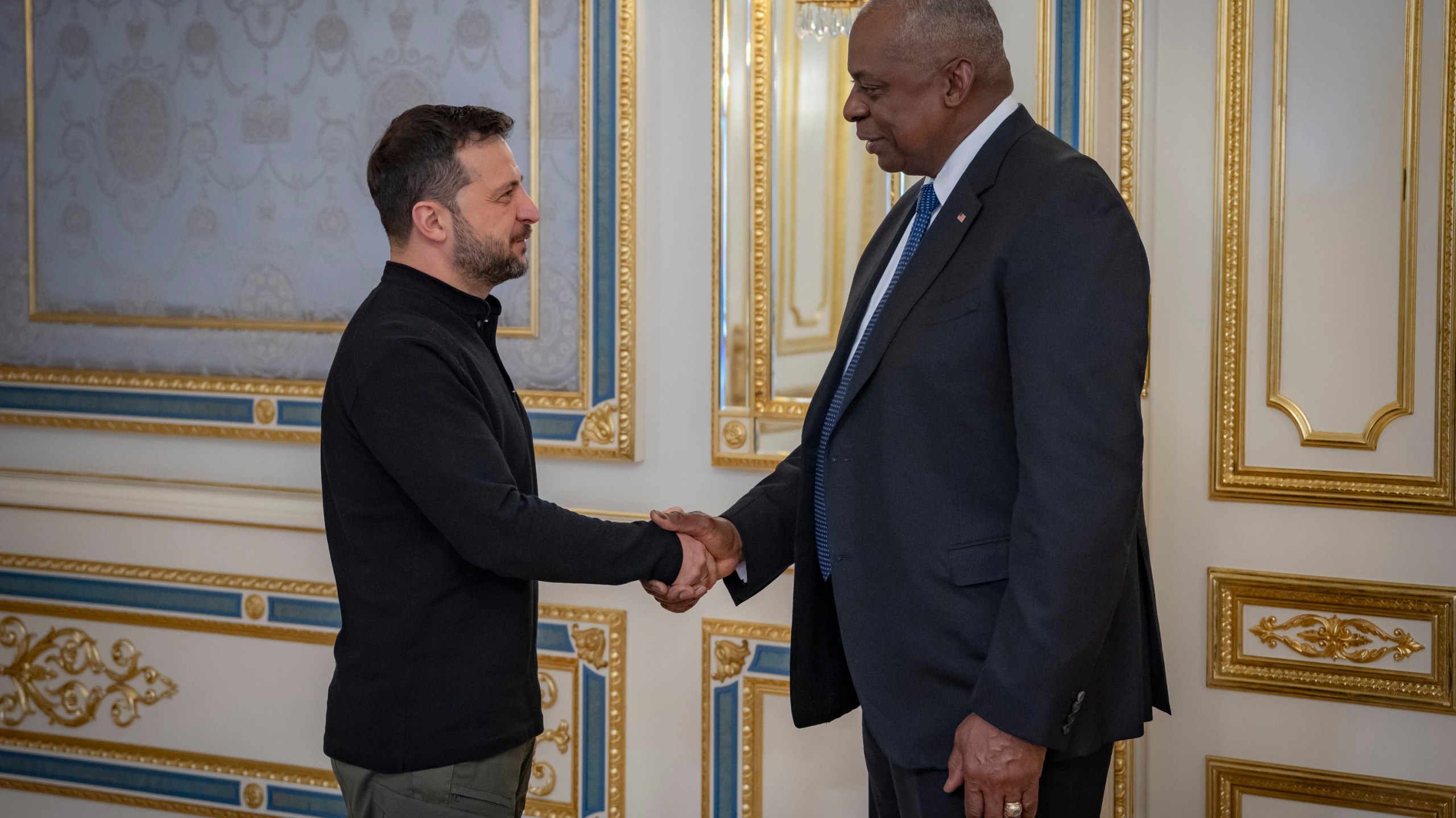 In this photo provided by the Press Service Of The President Of Ukraine on Oct. 21, 2024, U.S. Secretary of Defense Lloyd Austin, right, and Ukraine's President Volodymyr Zelenskyy shake hands during their meeting in Kyiv, Ukraine. (Press Service Of The President Of Ukraine via AP)