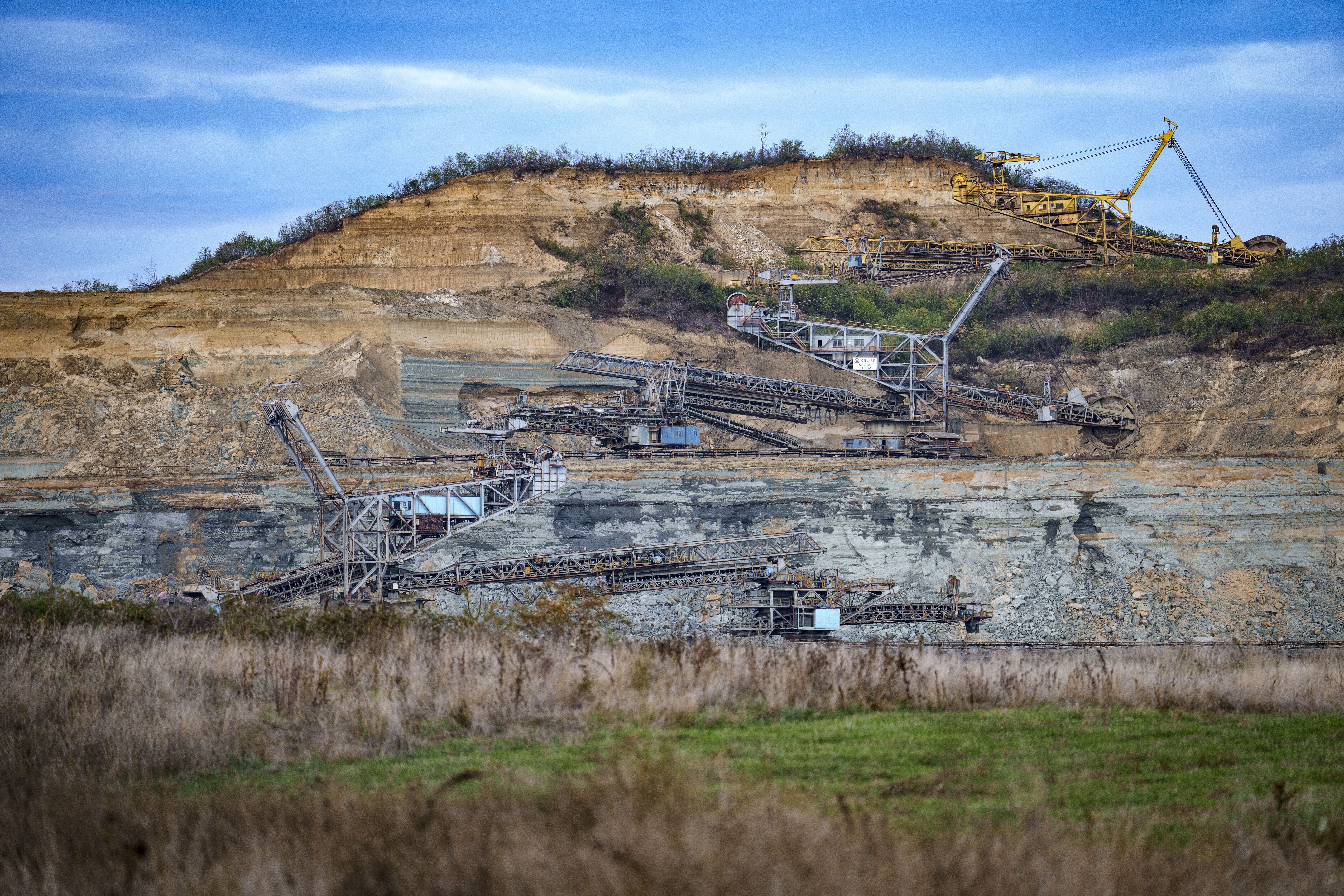 Coal extraction equipment operates at the open air quarry outside Matasari, southern Romania, Friday, Oct. 11, 2024. (AP Photo/Vadim Ghirda)