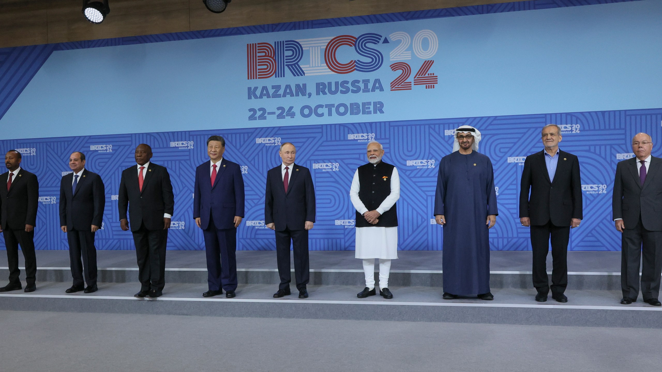 From left: Ethiopian Prime Minister Abiy Ahmed, Egyptian President Abdel Fattah el-Sisi, South African President Cyril Ramaphosa, Chinese President Xi Jinping, Russian President Vladimir Putin, Indian Prime Minister Narendra Modi, United Arab Emirates President Sheikh Mohammed bin Zayed Al Nahyan, Iranian President Masoud Pezeshkian and Brazilian Foreign Minister Mauro Vieira pose for a family photo prior to the BRICS Summit plenary session in Kazan, Russia, Wednesday, Oct. 23, 2024. (Maxim Shipenkov, Pool Photo via AP)