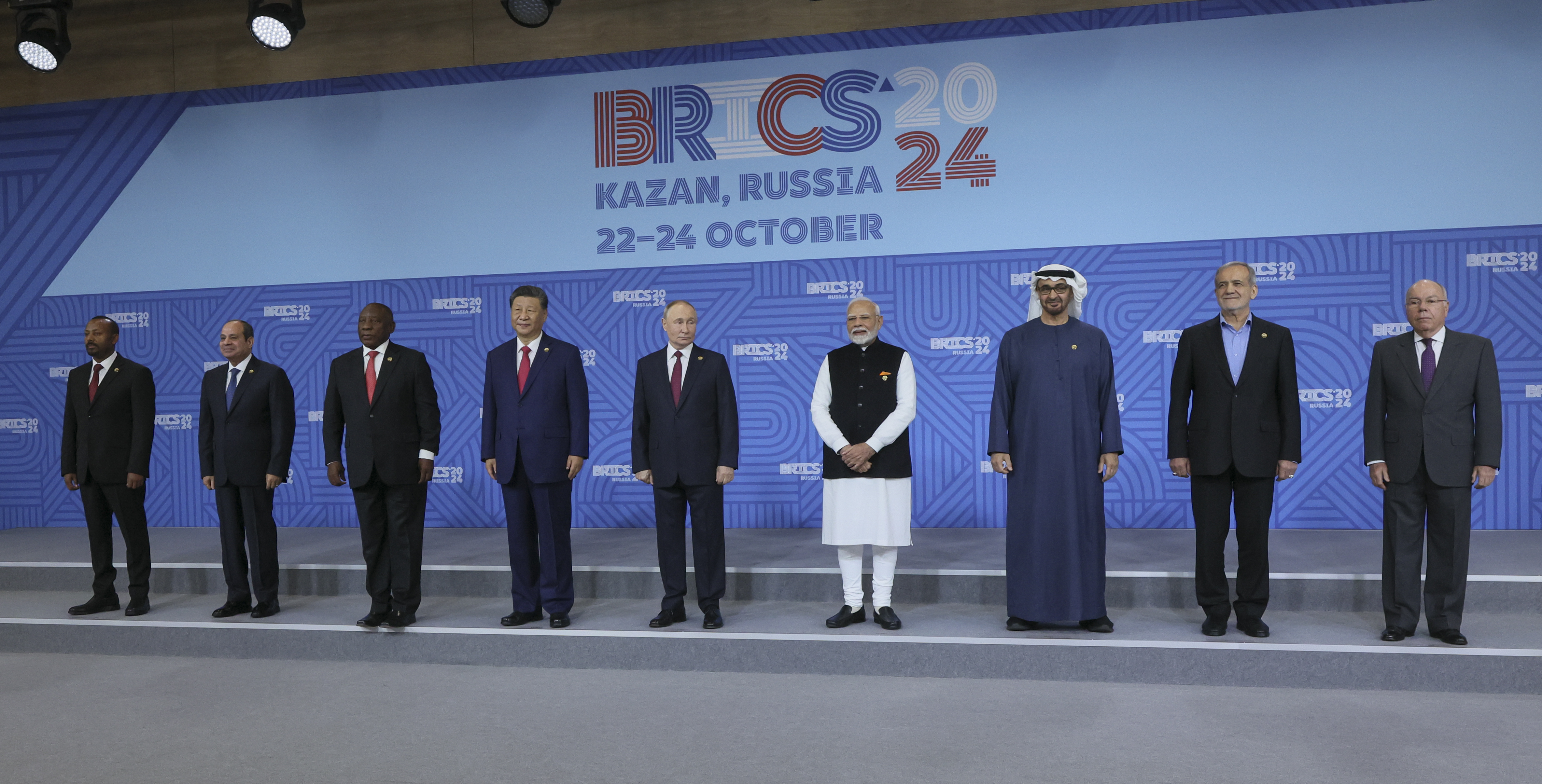 From left: Ethiopian Prime Minister Abiy Ahmed, Egyptian President Abdel Fattah el-Sisi, South African President Cyril Ramaphosa, Chinese President Xi Jinping, Russian President Vladimir Putin, Indian Prime Minister Narendra Modi, United Arab Emirates President Sheikh Mohammed bin Zayed Al Nahyan, Iranian President Masoud Pezeshkian and Brazilian Foreign Minister Mauro Vieira pose for a family photo prior to the BRICS Summit plenary session in Kazan, Russia, Wednesday, Oct. 23, 2024. (Maxim Shipenkov, Pool Photo via AP)