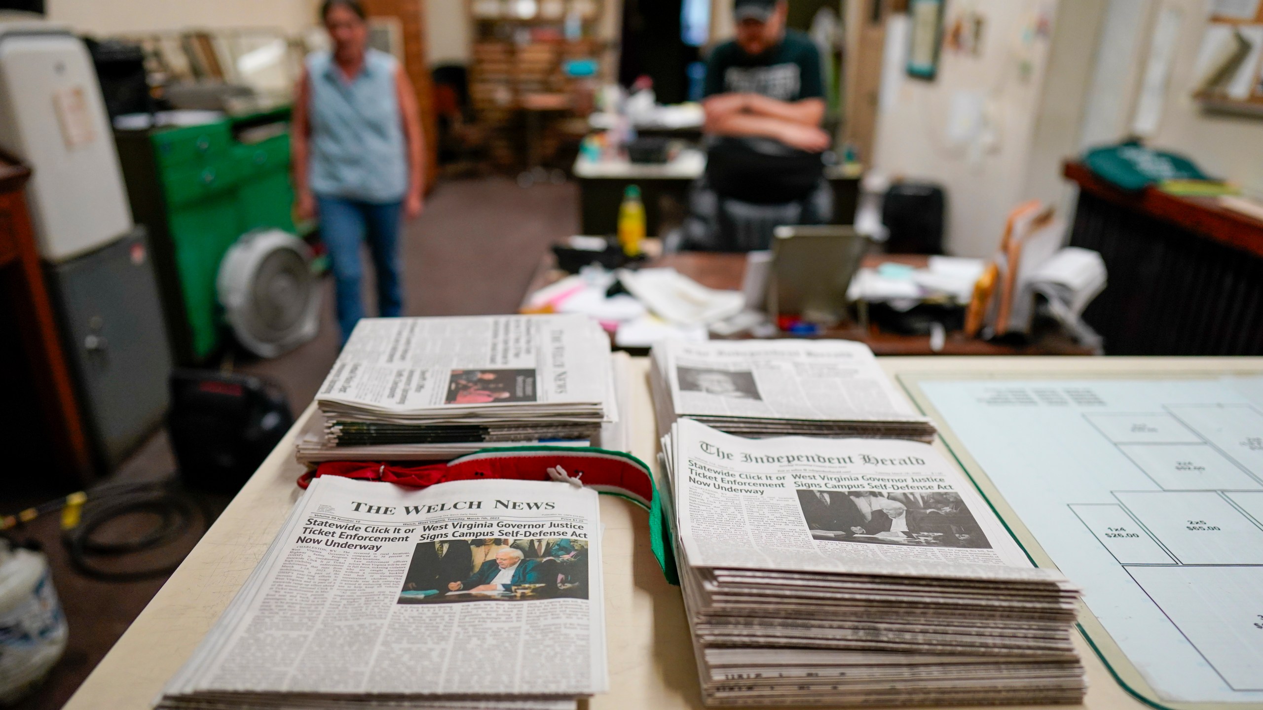 FILE - Missy Nester owner of the The Welch News walks around the closed office, May 31, 2023, in Welch, W.Va. (AP Photo/Chris Carlson, File)