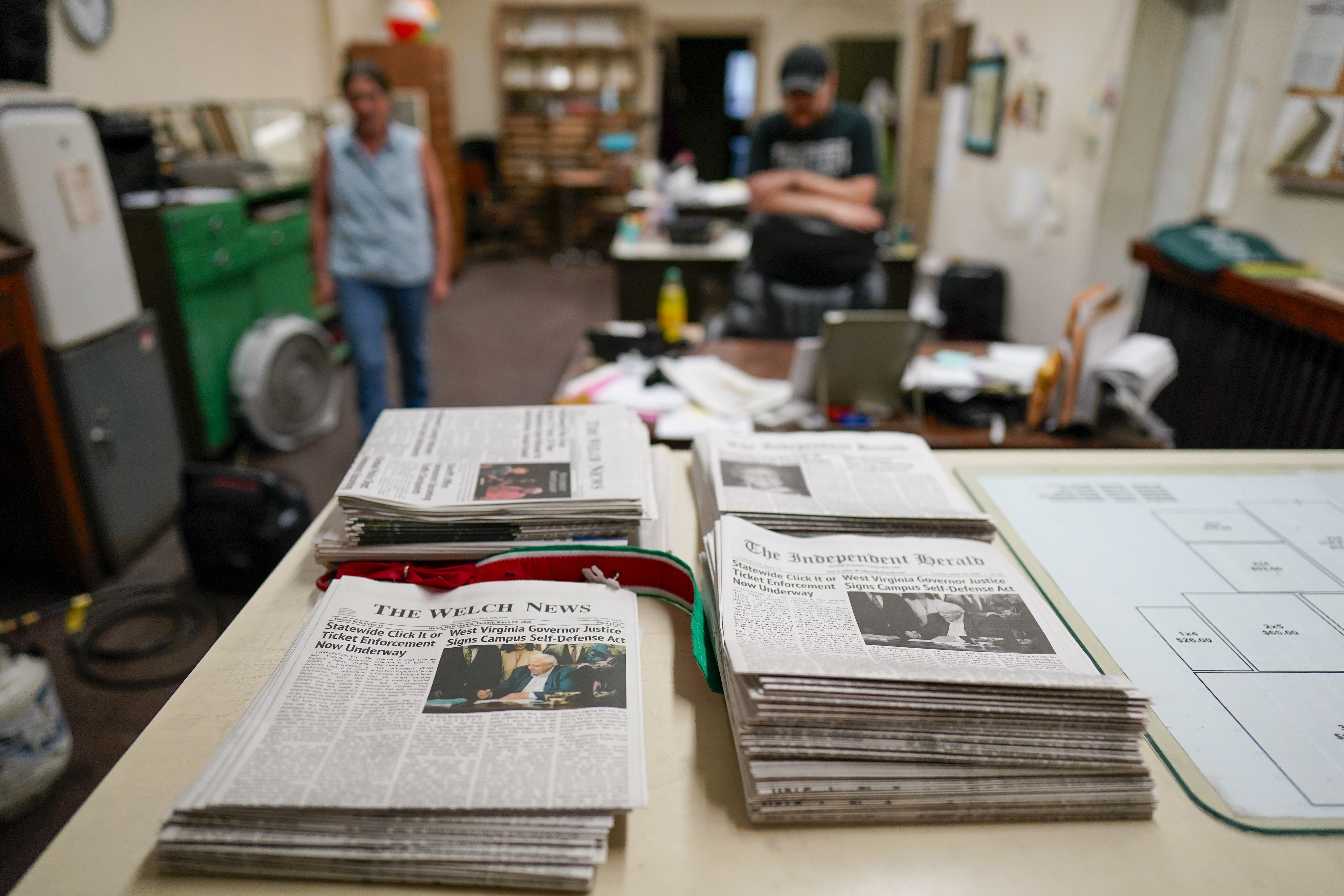 FILE - Missy Nester owner of the The Welch News walks around the closed office, May 31, 2023, in Welch, W.Va. (AP Photo/Chris Carlson, File)