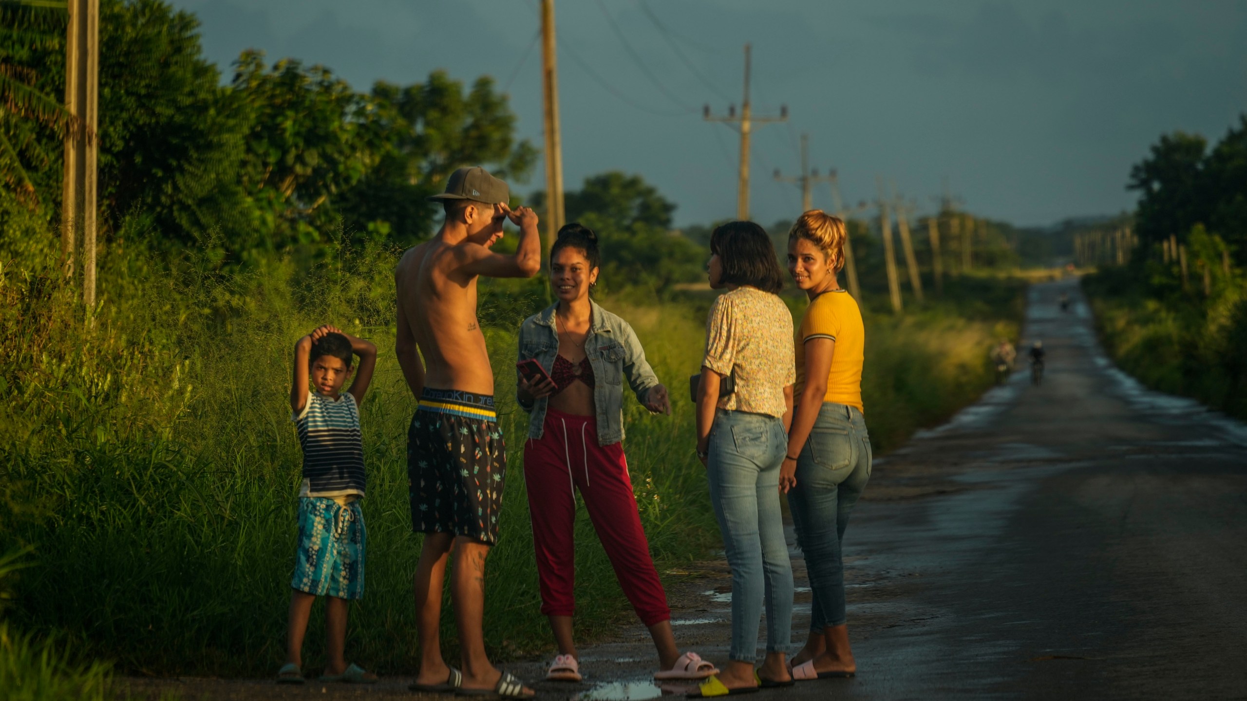 FILE - People chat on the side of a road in San Jose de las Lajas, Cuba, Oct. 22, 2024. (AP Photo/Ramon Espinosa, File)