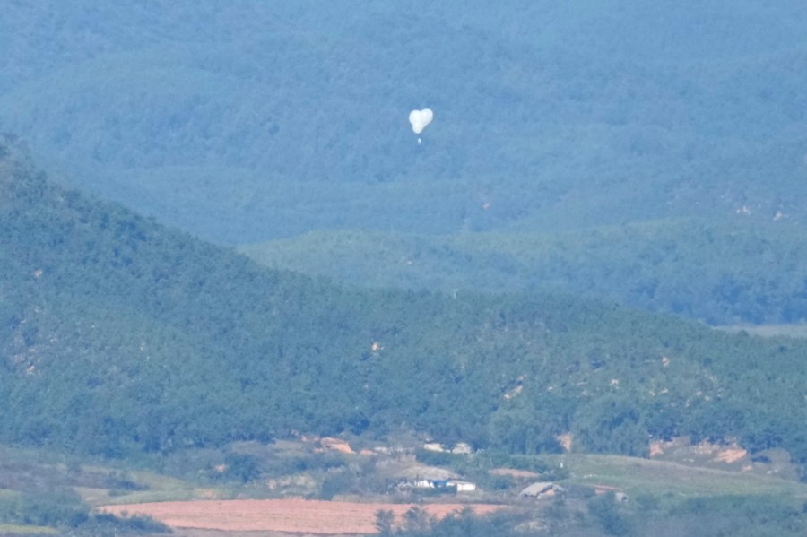 FILE - North Korean balloons are seen from the Unification Observation Post in Paju, South Korea, near the border with North Korea, on Oct. 4, 2024. (AP Photo/Lee Jin-man, File)