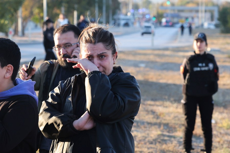 People gather outside of the Turkish Aerospace Industries Inc. on the outskirts of Ankara, Turkey, Wednesday, Oct. 23, 2024. (Yavuz Ozden/Dia Photo via AP)