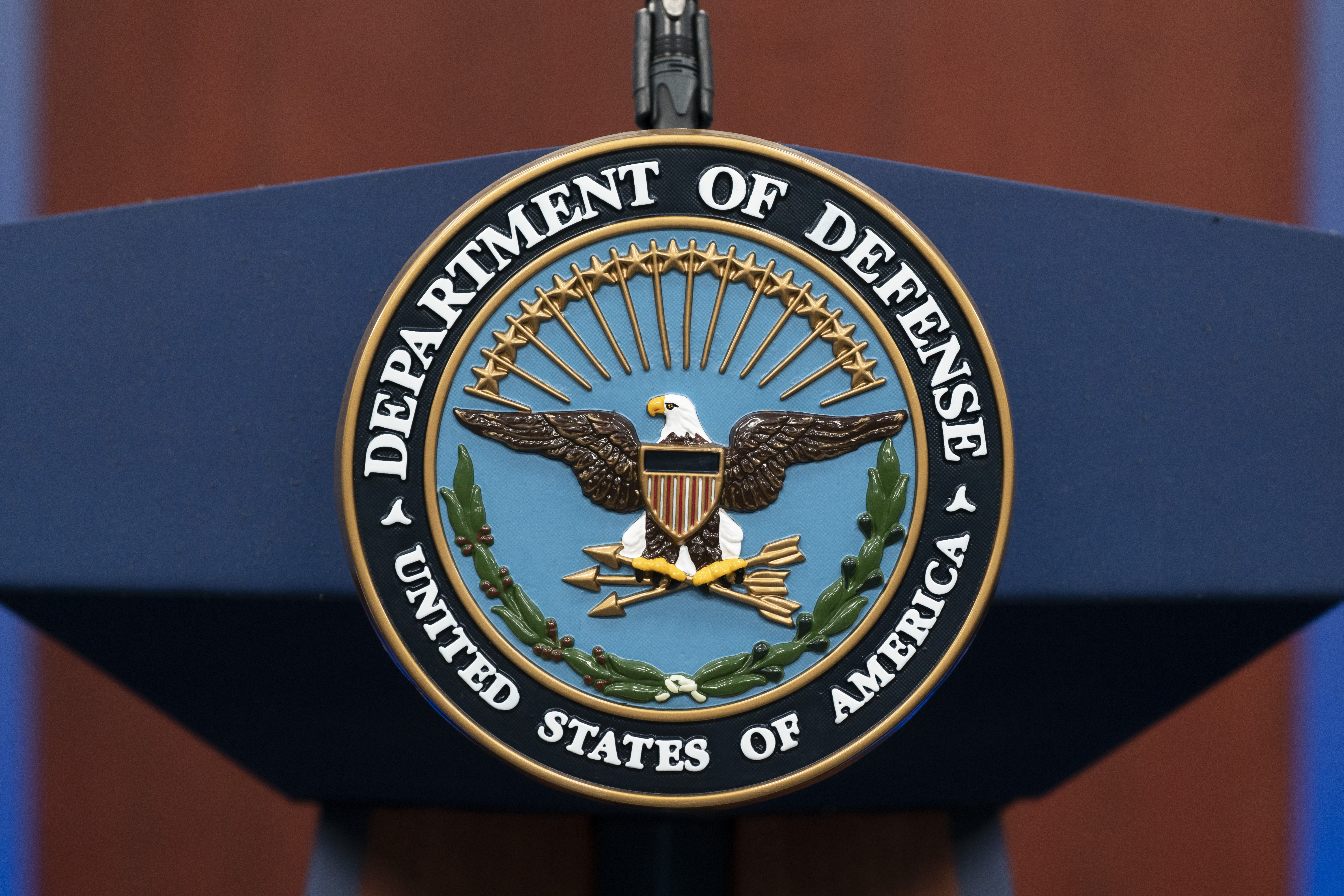 FILE - The seal of the Department of Defense is seen on the podium at the Pentagon, Sept. 27, 2022, in Washington. The Pentagon says the U.S. is sending an additional “few thousand” troops to the Middle East to bolster security and to be prepared to defend Israel if necessary. (AP Photo/Alex Brandon, File)