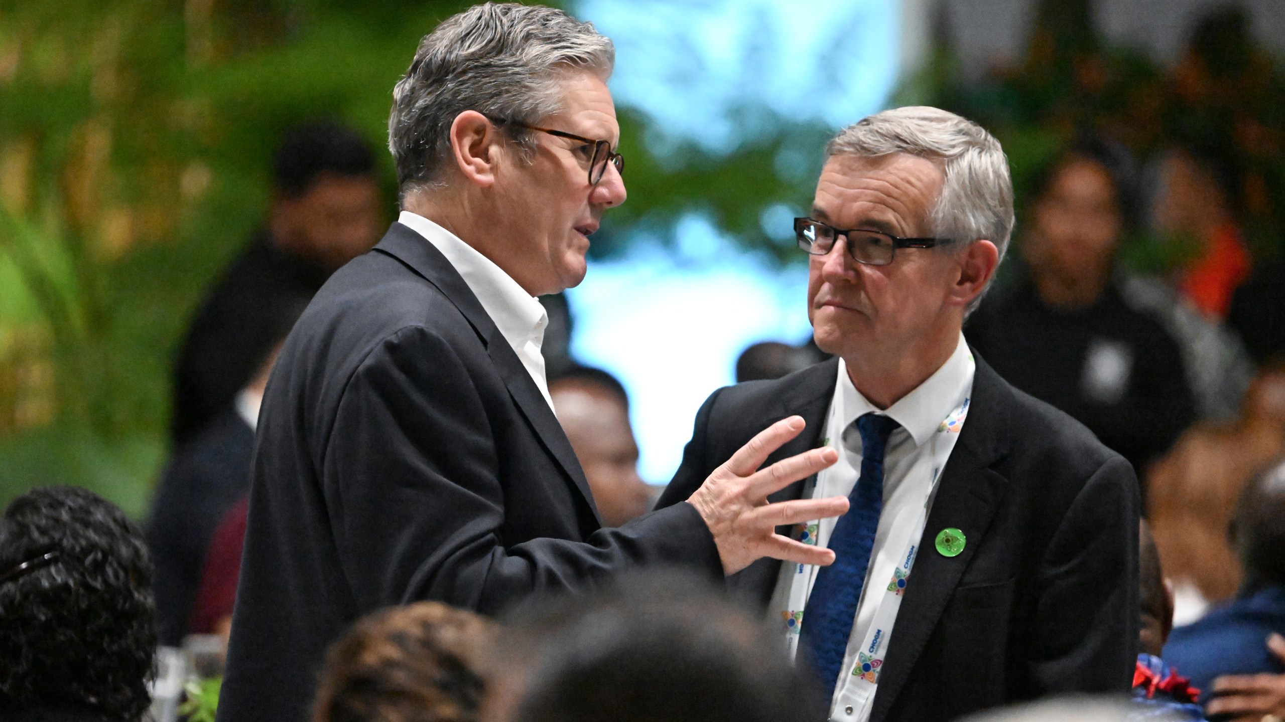 British Prime Minister Keir Starmer, left, attends a State Banquet during the Commonwealth Heads of Government Meeting (CHOGM) in Apia, Samoa, Thursday, Oct. 24, 2024. (William West/Pool Photo via AP)