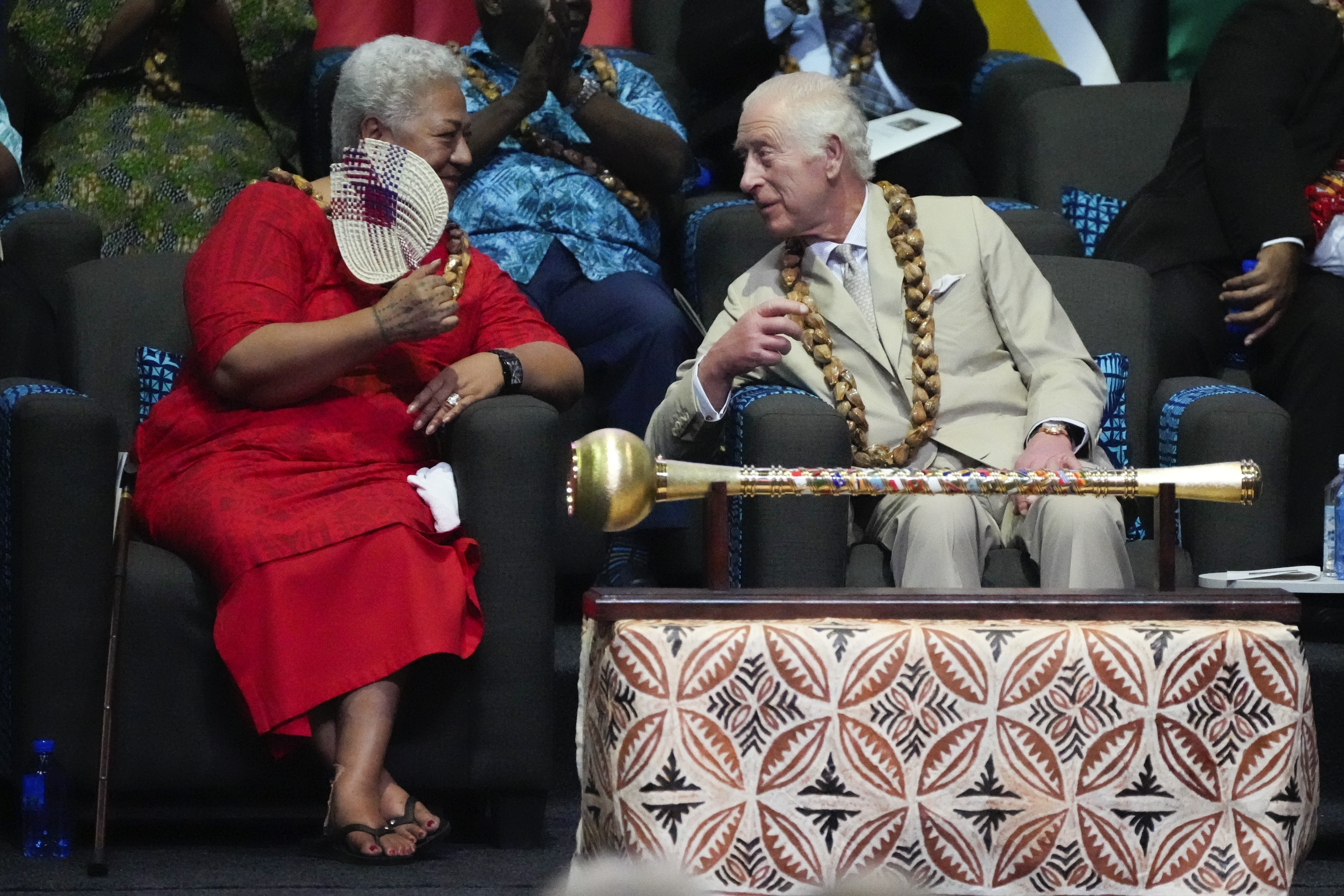 Britain's King Charles and Samoan Prime Minister Afioga Fiamē Naomi Mataʻafa, left, talk during the opening ceremony for the Commonwealth Heads of Government meeting in Apia, Samoa, Friday, Oct. 25, 2024. (AP Photo/Rick Rycroft/Pool)