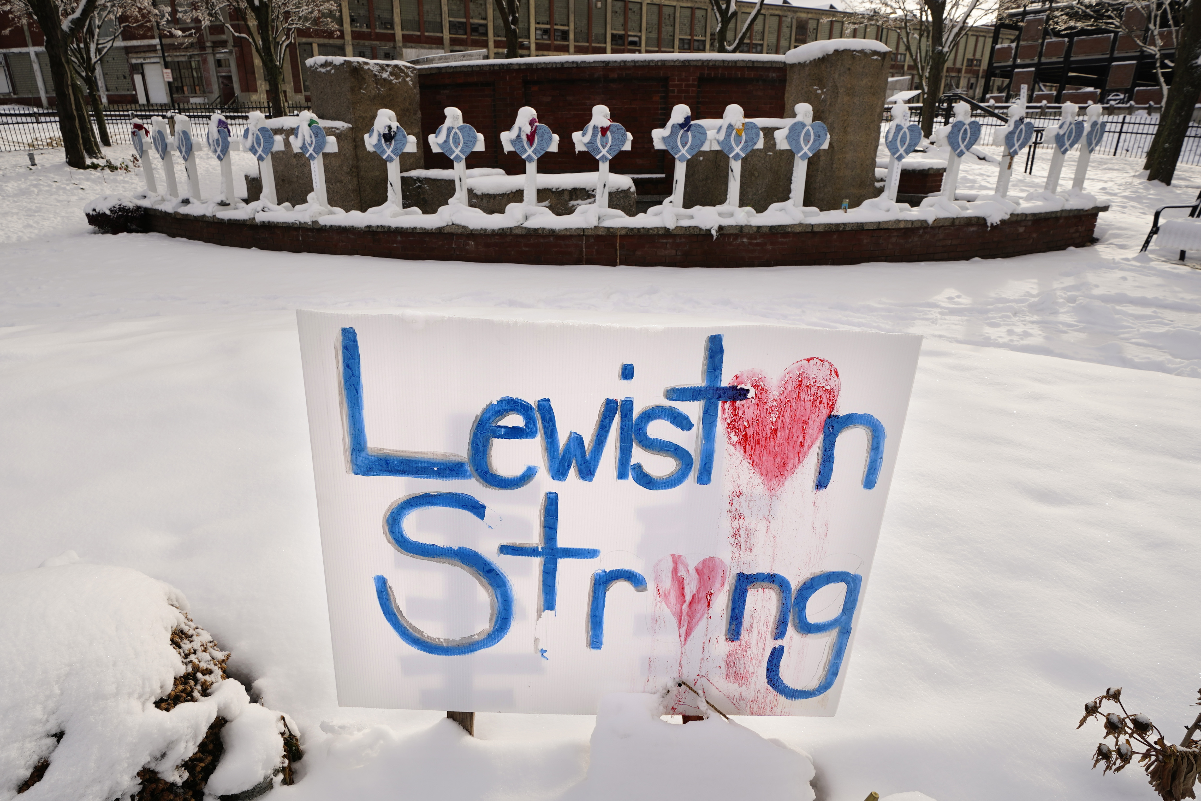 FILE - Snow coats crosses at one of several memorials for the victims of last month's mass shooting in Lewiston, Maine, in this Tuesday, Dec. 5, 2023 file photo. (AP Photo/Robert F. Bukaty, File)