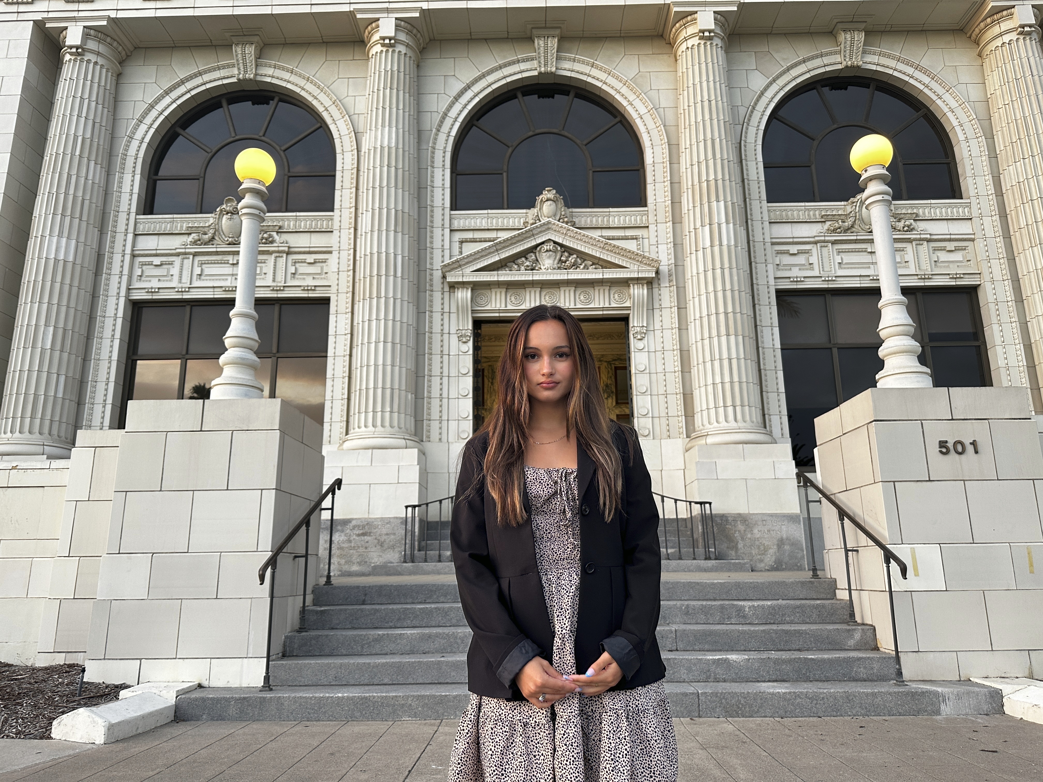 Kaylin Hayman, 17, poses outside Ventura City Hall in Ventura, Calif., Oct. 17, 2024. (AP Photo/Eugene Garcia)