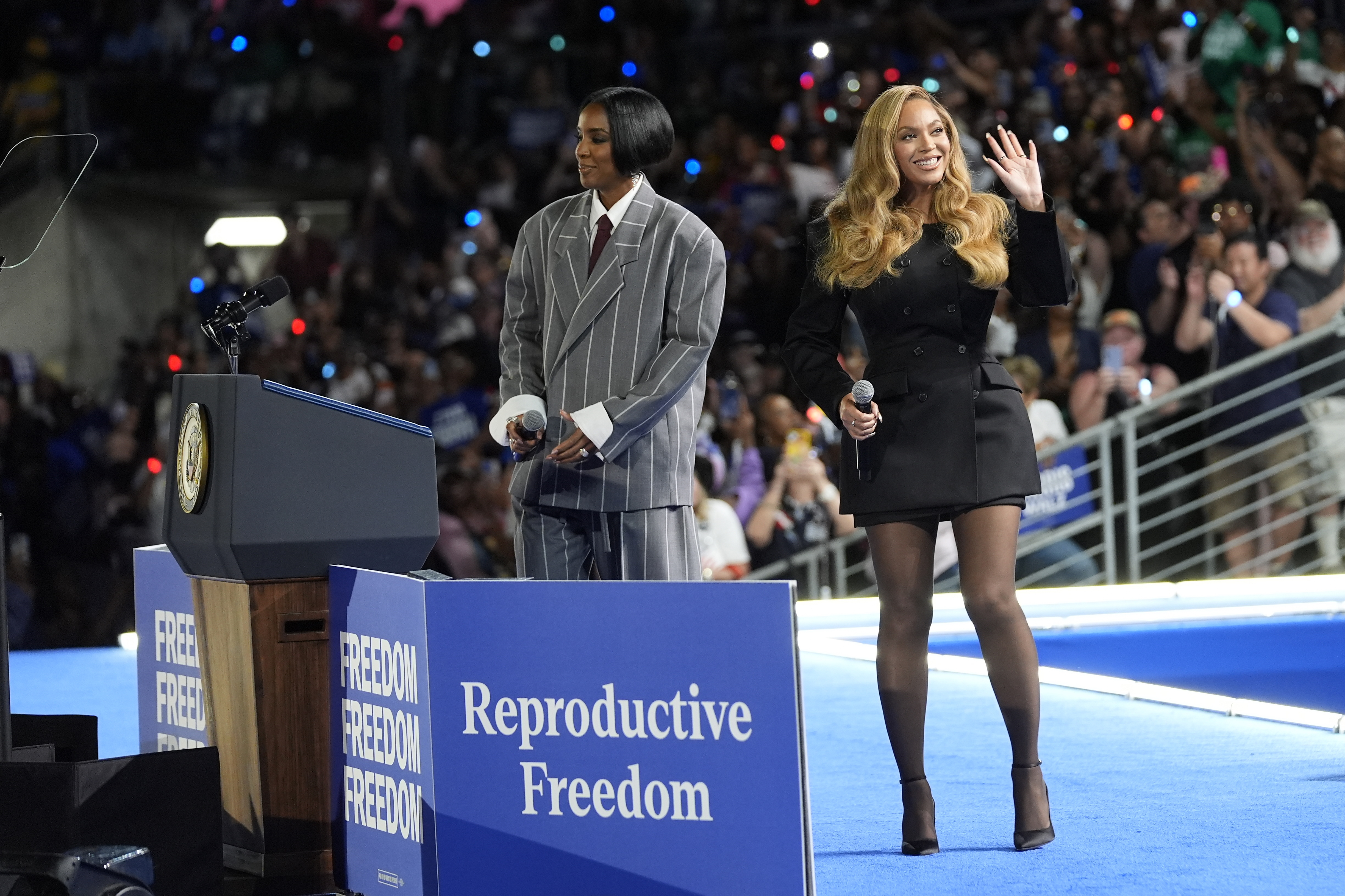 Musical artists Beyonce, right, and Kelly Rowland, left, on stage at a campaign event for Democratic presidential nominee Vice President Kamala Harris in Houston, Friday, Oct. 25, 2024. (AP Photo/Susan Walsh)