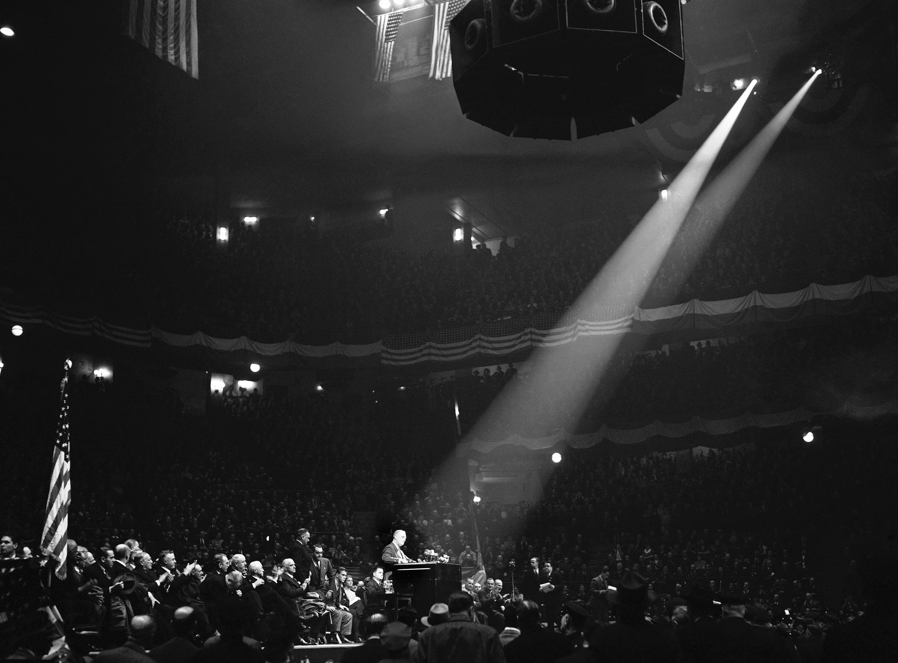 FILE - This is part of the crowd which packed New York City's Madison Square Garden on Oct. 28, 1940 to hear President Franklin Roosevelt charge in a campaign speech that the "responsible leadership of the republican party" had tried to "sabotage" increased defense appropriations and block aid to Britain prior to the present election campaign. (AP Photo/Harry Harris, File)