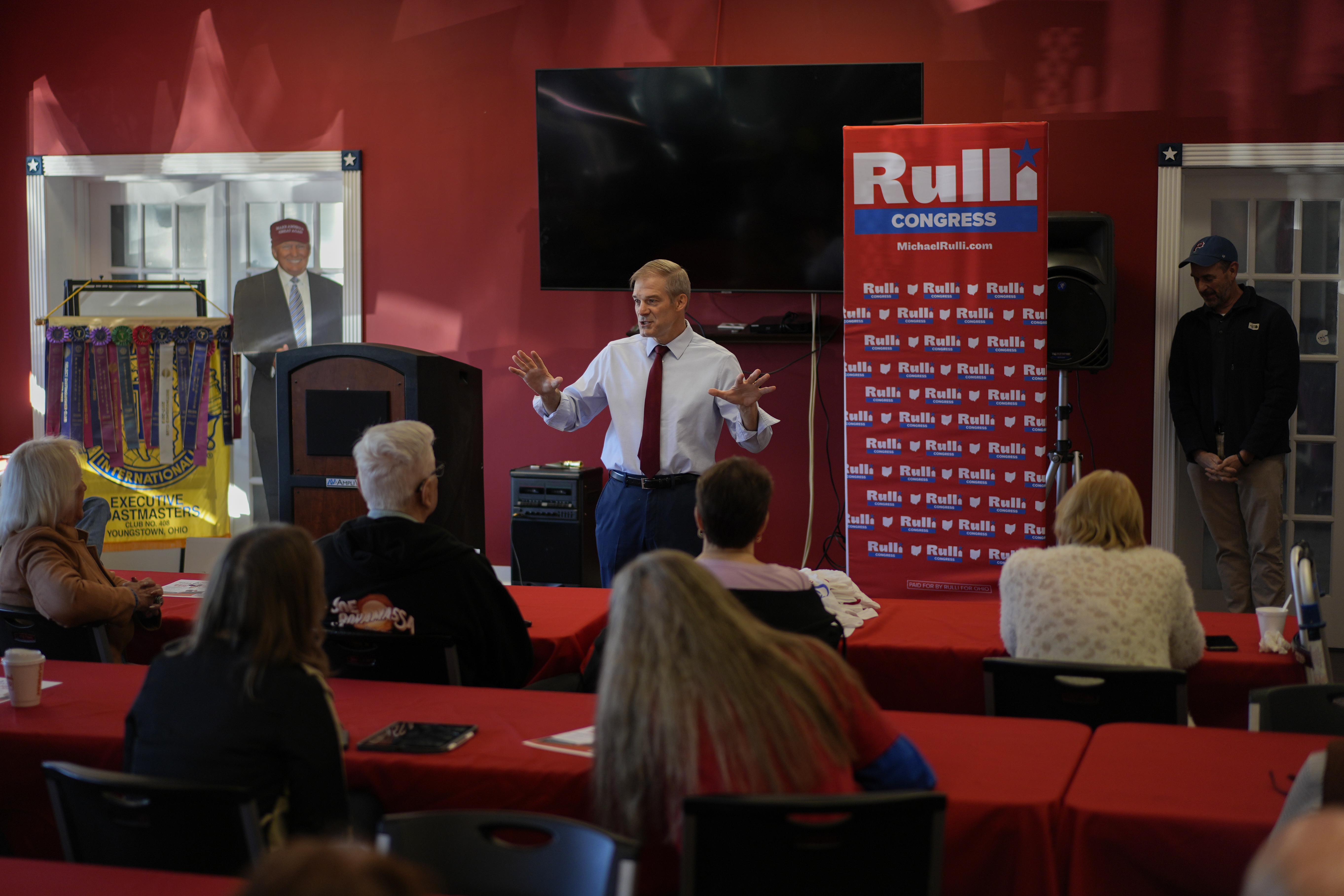 Rep. Jim Jordan, R-Ohio, speaks at a rally for Rep. Michael Rulli, R-Ohio, standing right, at the Mahoning County Republican Party headquarters in Boardman, Ohio, Thursday, Oct. 17, 2024. A cardboard cutout of Republican presidential nominee former President Donald Trump is seen left. (AP Photo/Carolyn Kaster)