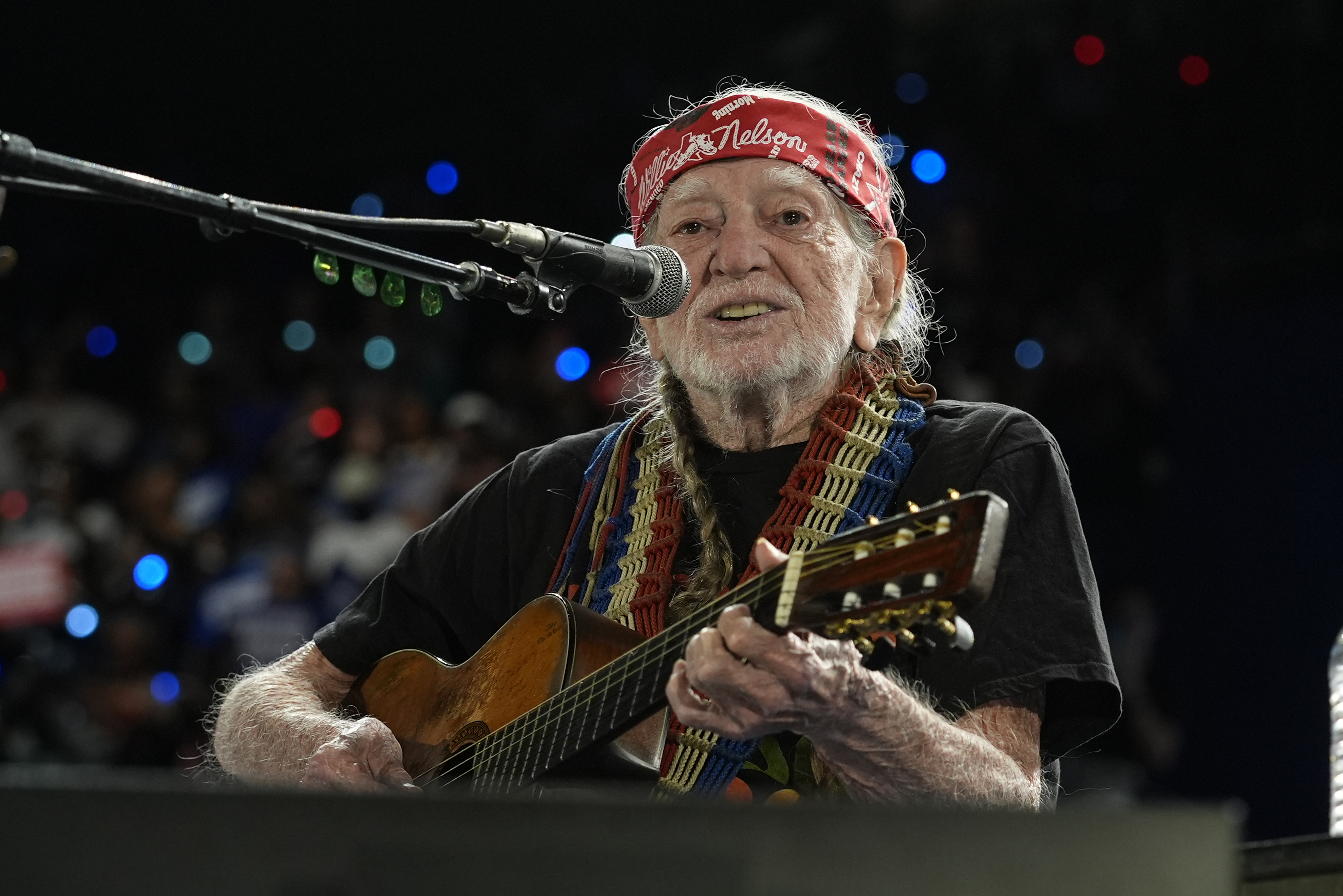 Musician Willie Nelson performing ahead of event for Democratic presidential nominee Vice President Kamala Harris at a rally in Houston, Friday, Oct. 25, 2024. (AP Photo/Susan Walsh)