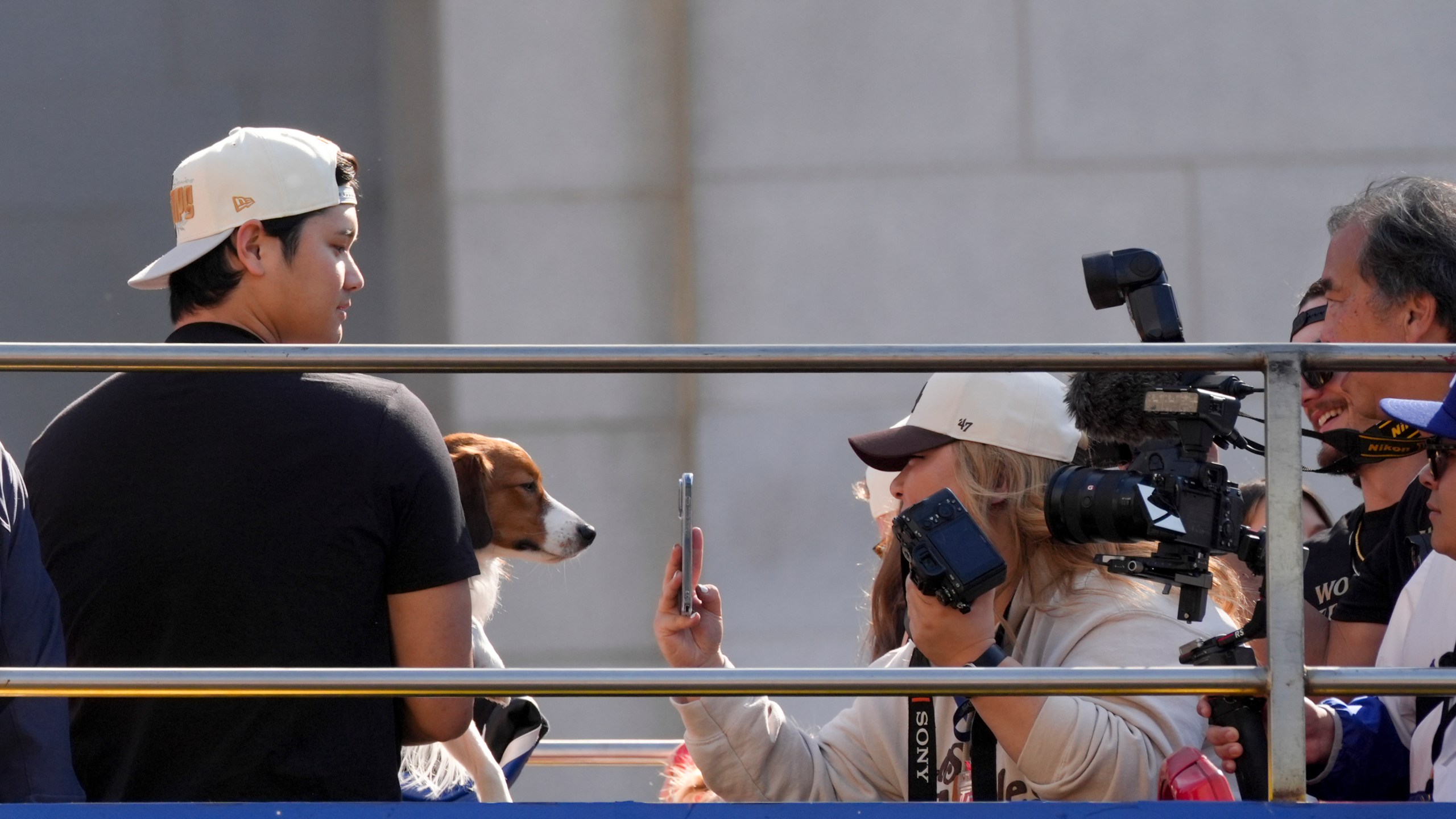 Los Angeles Dodgers' Shohei Ohtani is photographed with his dog Decoy during the Los Angeles Dodgers baseball World Series championship parade Friday, Nov. 1, 2024, in Los Angeles. (AP Photo/Jae C. Hong)